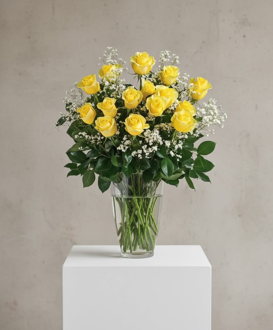 Golden Love - Dozen Rose Arrangement  - Bright, cheerful, and full of warmth, this arrangement features twelve radiant yellow roses beautifully arranged with fresh greenery in a classic vase. Symbolizing joy, friendship, and happiness, yellow roses make a perfect gift for celebrating smiles, milestones, or simply spreading sunshine. A vibrant and uplifting choice for any occasion.