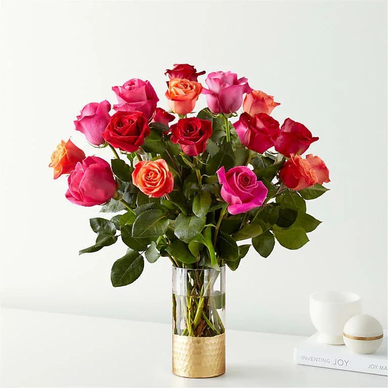 Ever After Rose Bouquet - Live happily with the Ever After Rose Bouquet. Celebrating Valentine's Day's favorite flower, this arrangement features three vibrant hues: orange, hot pink, and red. This trifecta will warm any space they're displayed in and any recipient's heart.