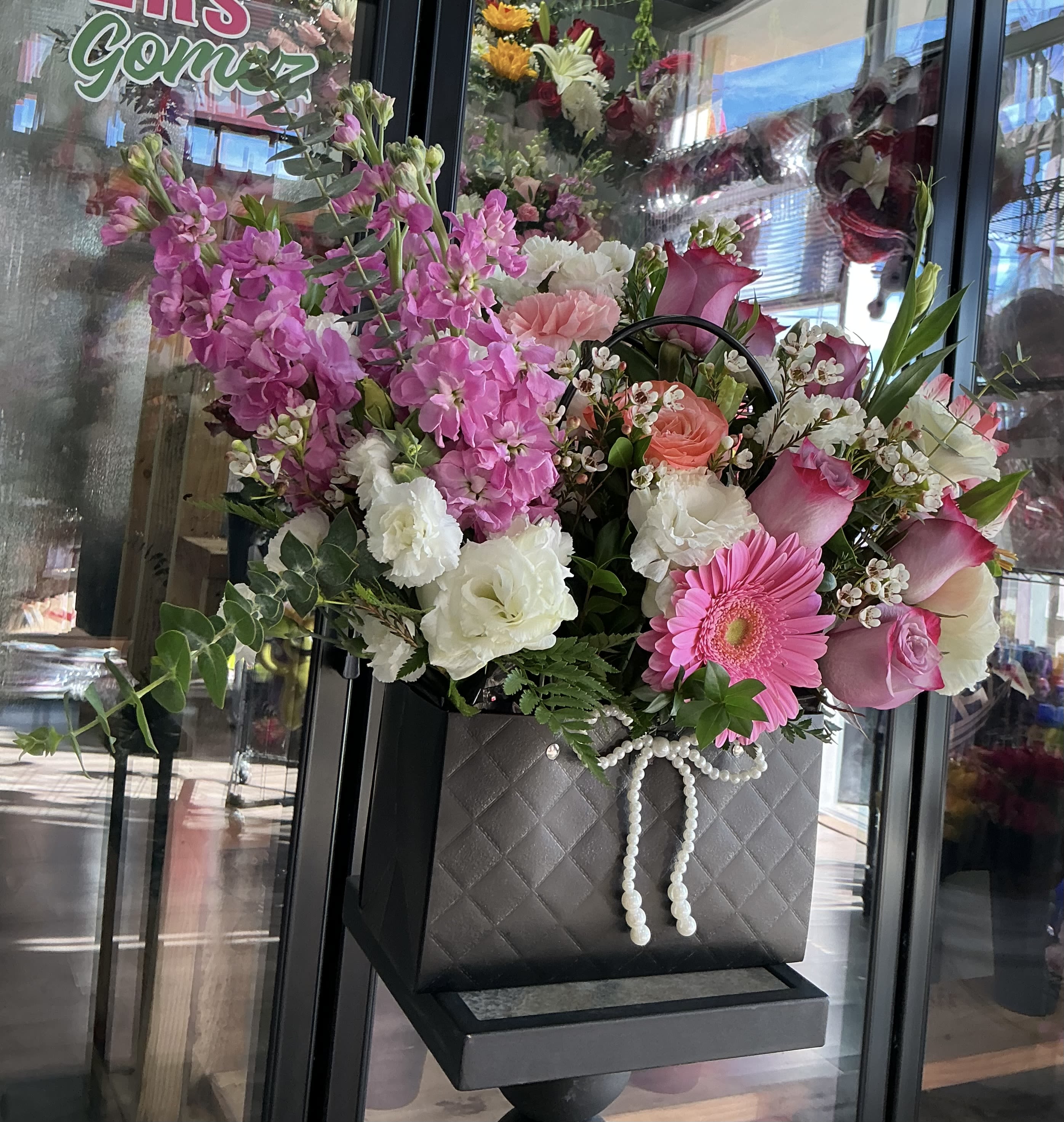 Coquette  - This beautiful coquette black handbag ,made of roses , carnation ,greens and much more this surprise your love one 