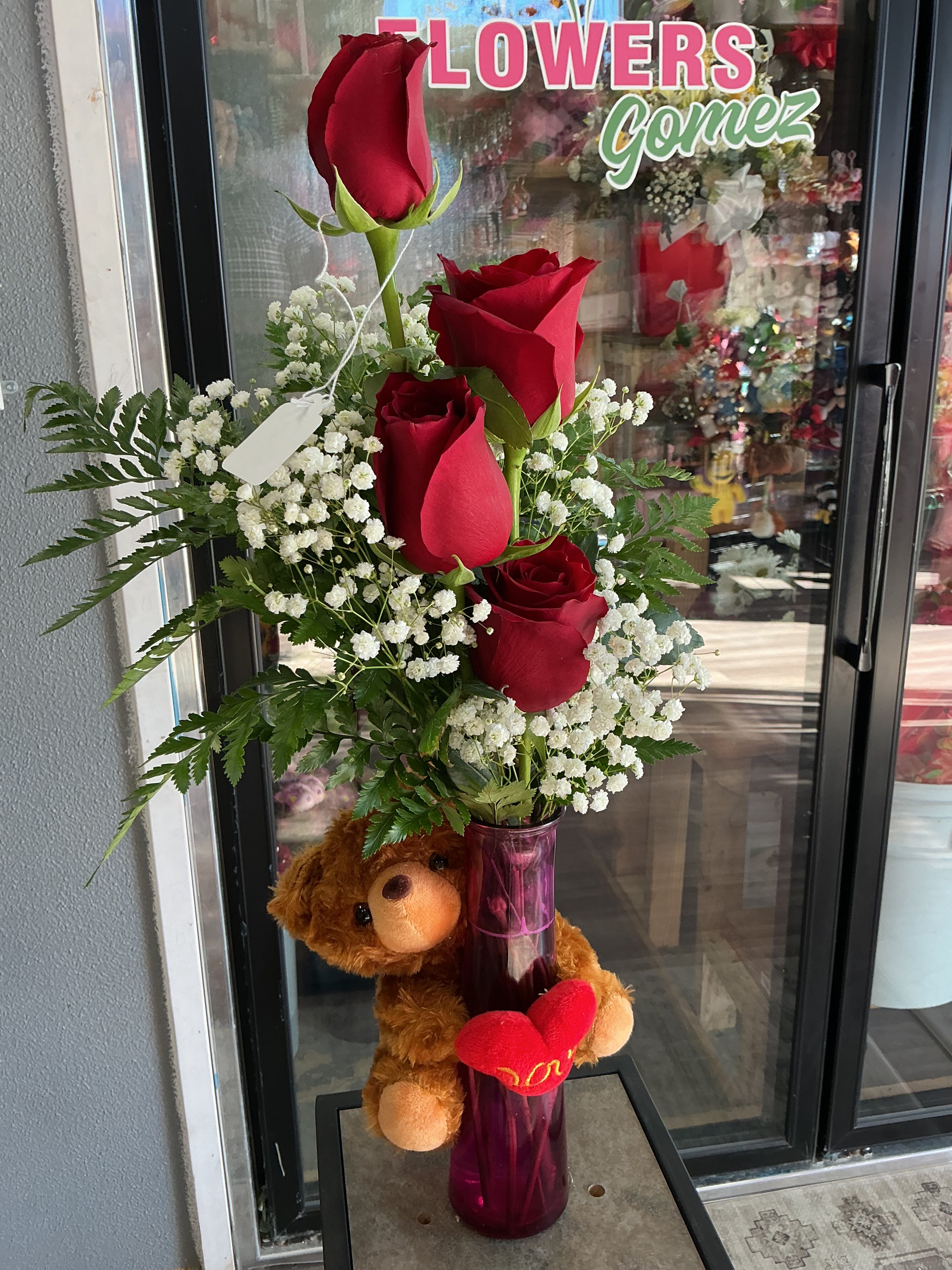  Very brown  - This very cute arrengment is made of beautiful,red roses , and a very beautiful brown bear .