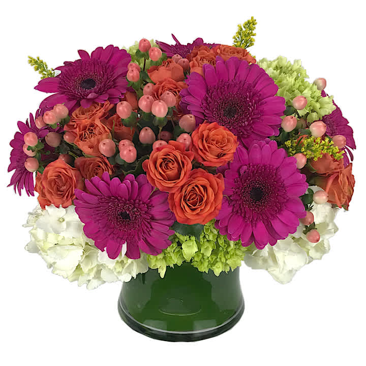Bright Delight - a glass vase filled with a seasonal assortment of vivid bright colors