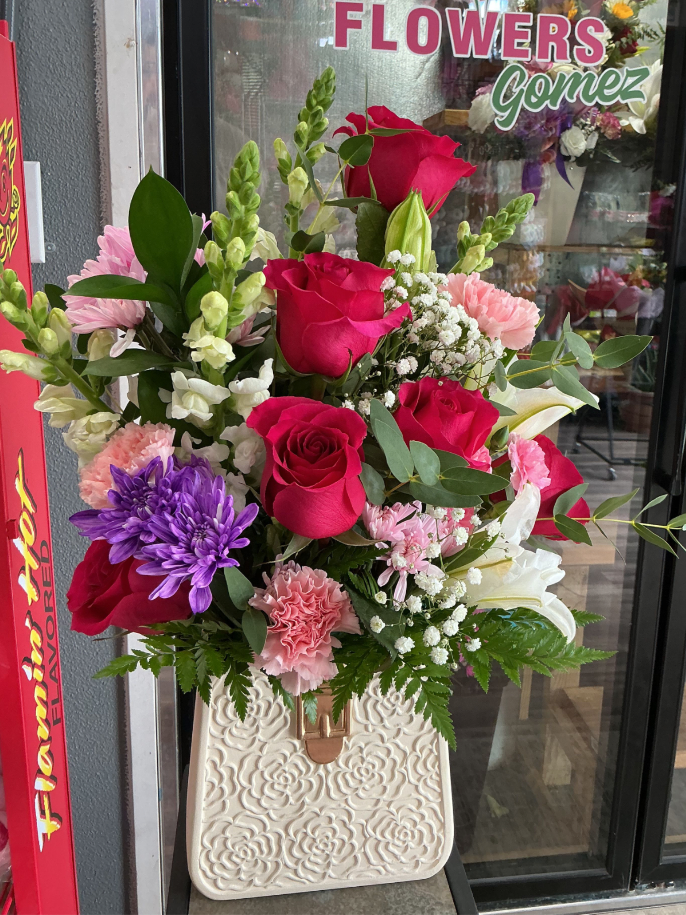 Great love  - This arrengment is a fantastic way to star any moment made with some pink roses ,light pink carnations,eucalyptus,green leather,white lilies,and baby breath 