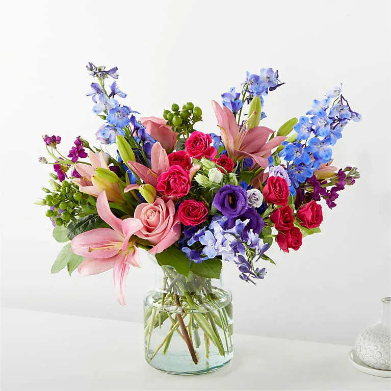 BREEZY MEADOWS BOUQUET - Bursting with exquisite colors and voluminous texture, the Breezy Meadows Bouquet brings the beauty of nature indoors, leaving your recipient feeling grounded and loved.