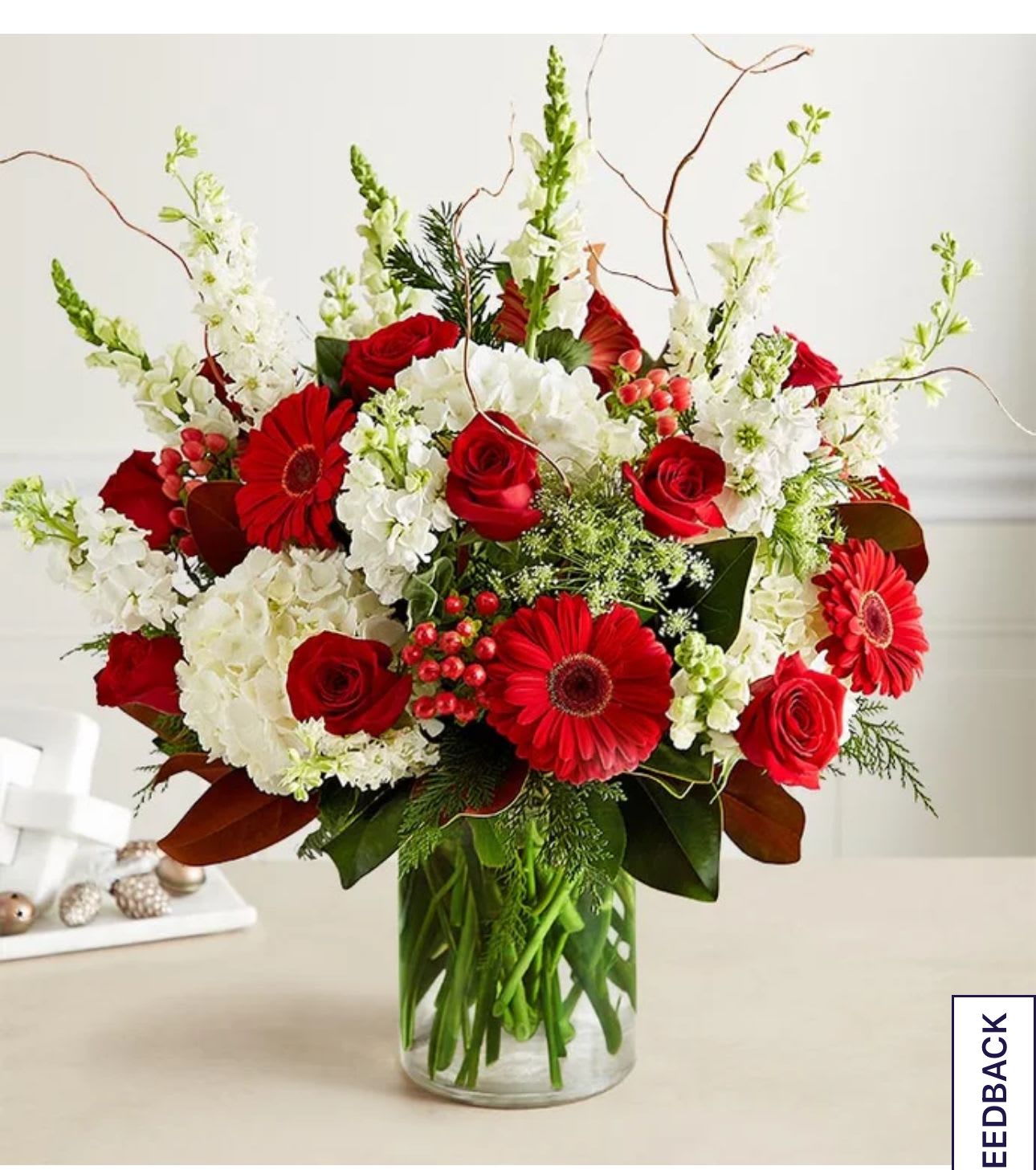 Lovely bouquet - Some gifts have a way of capturing the many blessings of the Christmas season. Our luxury gathering brings together a unique variety of white hydrangeas with roses and Gerbera daisies for a festive splash of holiday red. Curly willow and lush greens add a rustic, nature-inspired feel. With exquisite style and texture, it’s a beautiful reminder of all we have to celebrate.