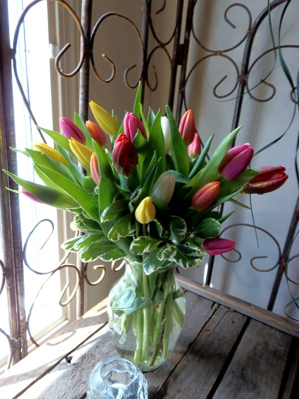 Rainbow of Tulips  - Rainbow of Tulips Brighten any space with this cheerful bouquet of 20 vibrant tulips in a mix of colors, artfully arranged in a stylish vase. Each arrangement is unique—colors may vary based on seasonal availability, creating a delightful rainbow of fresh blooms perfect for any occasion. # Please note container selection may vary due to limited production of vase style from our wholesalers. Substitutions may occur and or color may vary. Thank you for understanding.