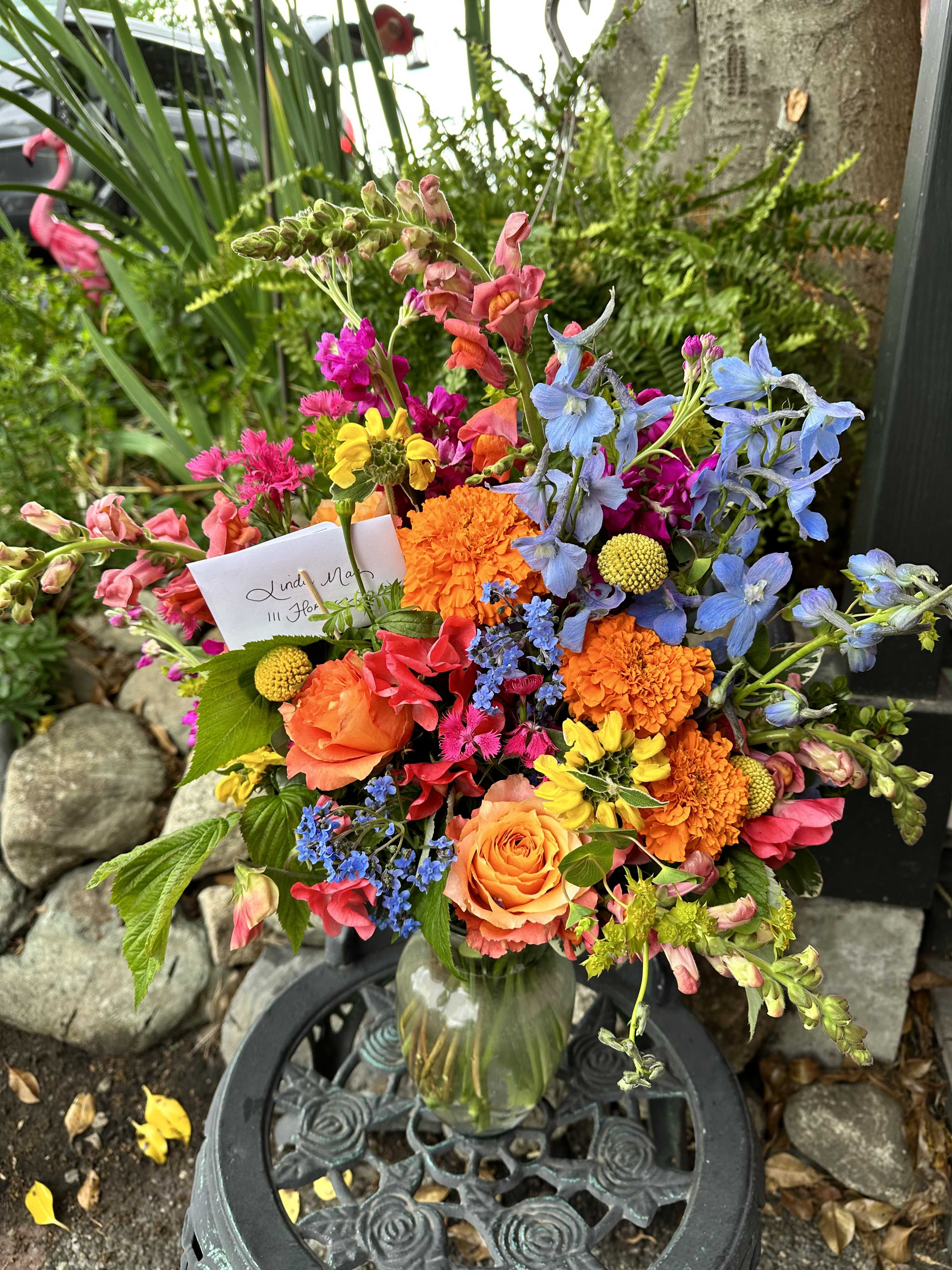 Bright Bouquet-Designer's Choice - A delightful bouquet with Bright Blossoms. Created with love and intention. Available in Tall or Low and Lush.  *Please Note that photo is an example of flowers included in design. We will choose the finest blooms for high impact!