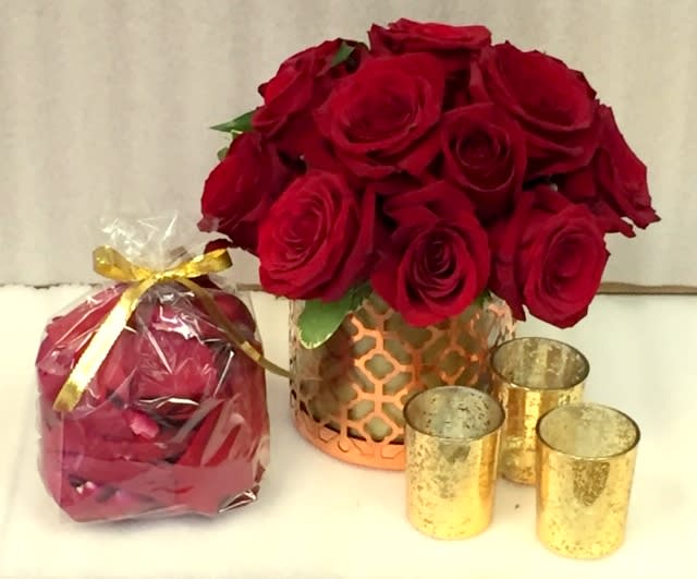 Tonight's the Night - One stop shopping...roses arranges in a keepsake vessel, rose petals and votive candles set the stage for a special night!