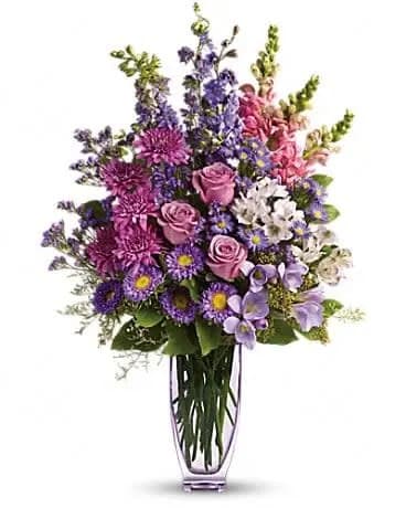Steal The Show with Roses - You won't have to worry about any other bouquet upstaging this gift! At over two feet tall, this is a fabulous way to show someone how much they mean to you. Lovely lavender roses, alstroemeria, larkspur, freesia, matsumoto asters and limonium are joined by light pink snapdragons, purple monte cassino asters and statice in an exclusive lavender Jewel Vase. The bouquet will definitely steal the show. You might even steal someone's heart. 