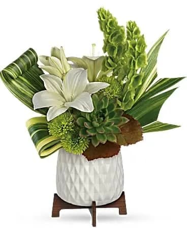 Artistic Angles Bouquet - Celebrate with style! Presented in a mid-century ceramic planter with unique geometric motif, this artistic lily arrangement is one they'll never forget. A stunning gift from any angle! Add style to their celebration with this artistic lily arrangement, presented in a chic mid-century ceramic planter with sleek wood base. 