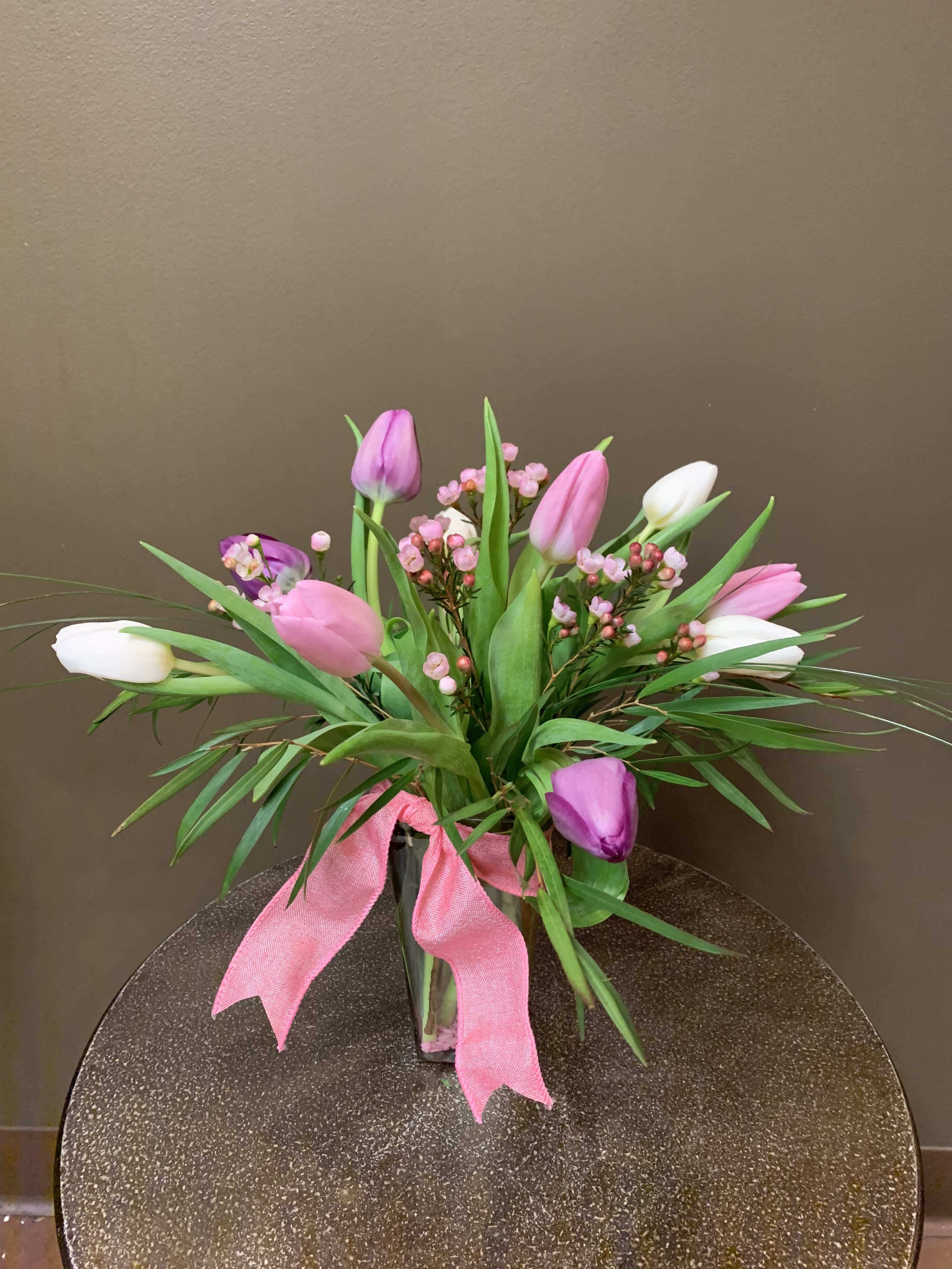10 Spring Tulips - Nothing says come on spring like 10 tulips arranged in a vase. We have a nice color assortment.