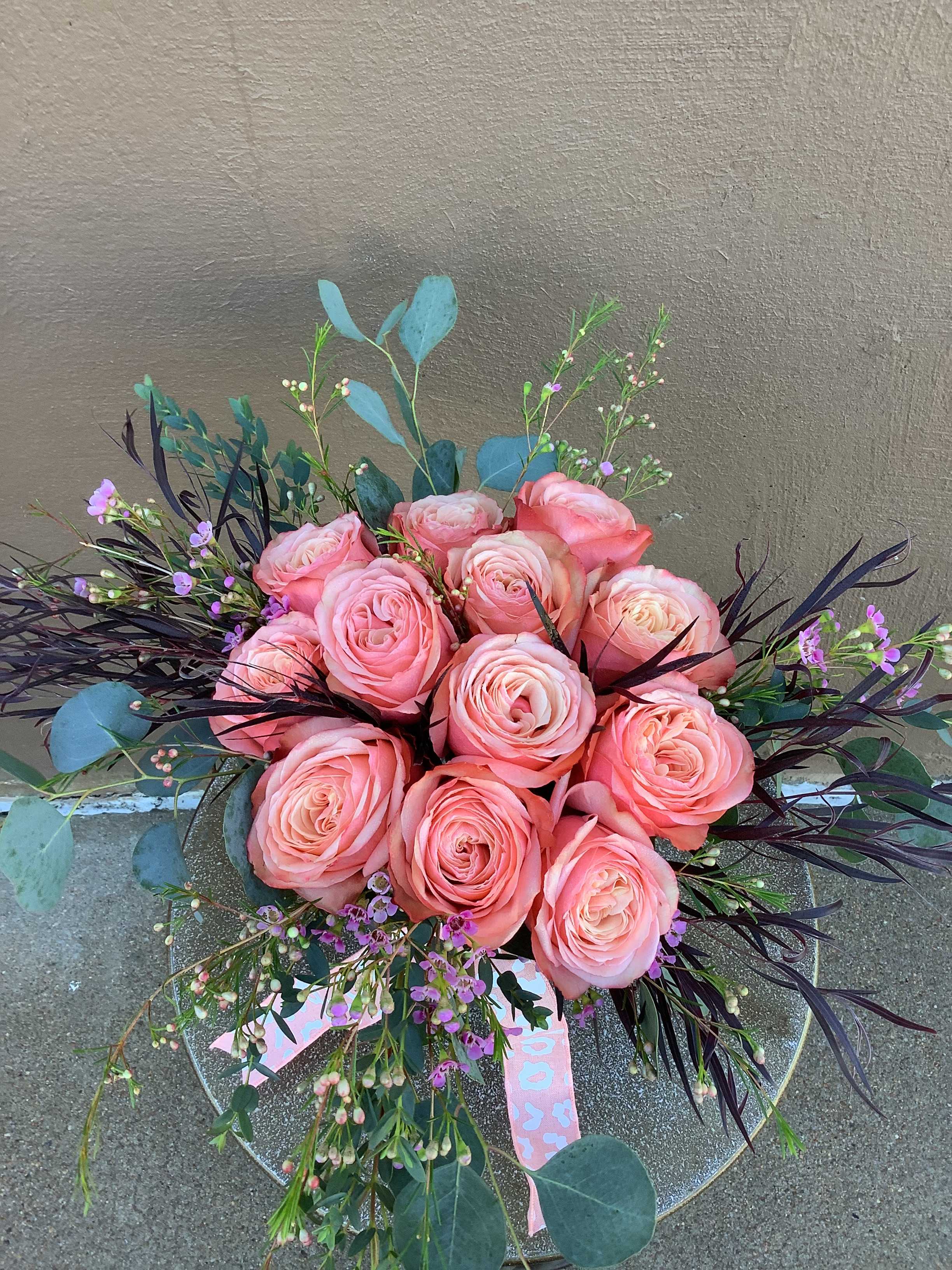 Dozen Roses Low and Lush Peach Tones - 12 beautiful peach/coral/orange roses arranged low and lush.