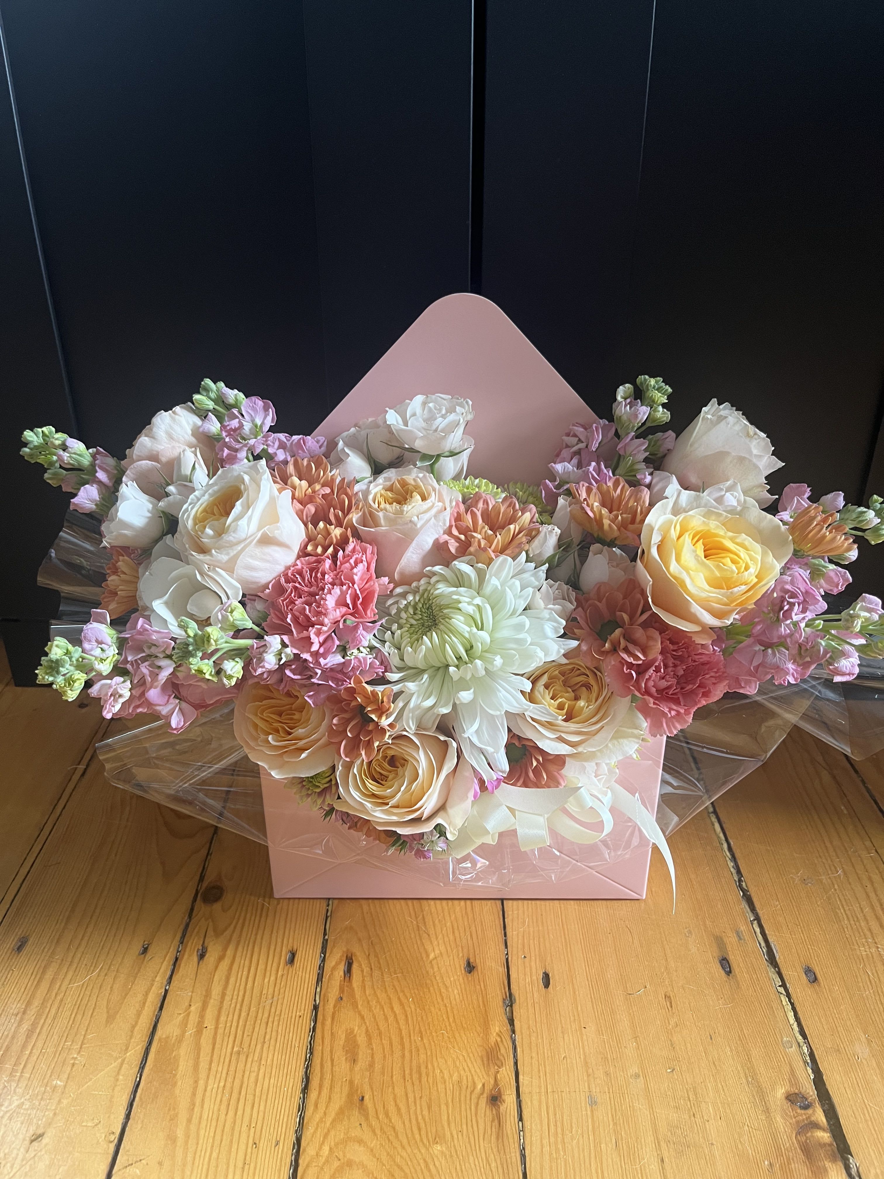 FLOWER MAIL - Send a gift of love or care through this chic envelope full of flowers.  Perfect for any occasion and always filled with the seasons best.  The perfect way to send any message.  