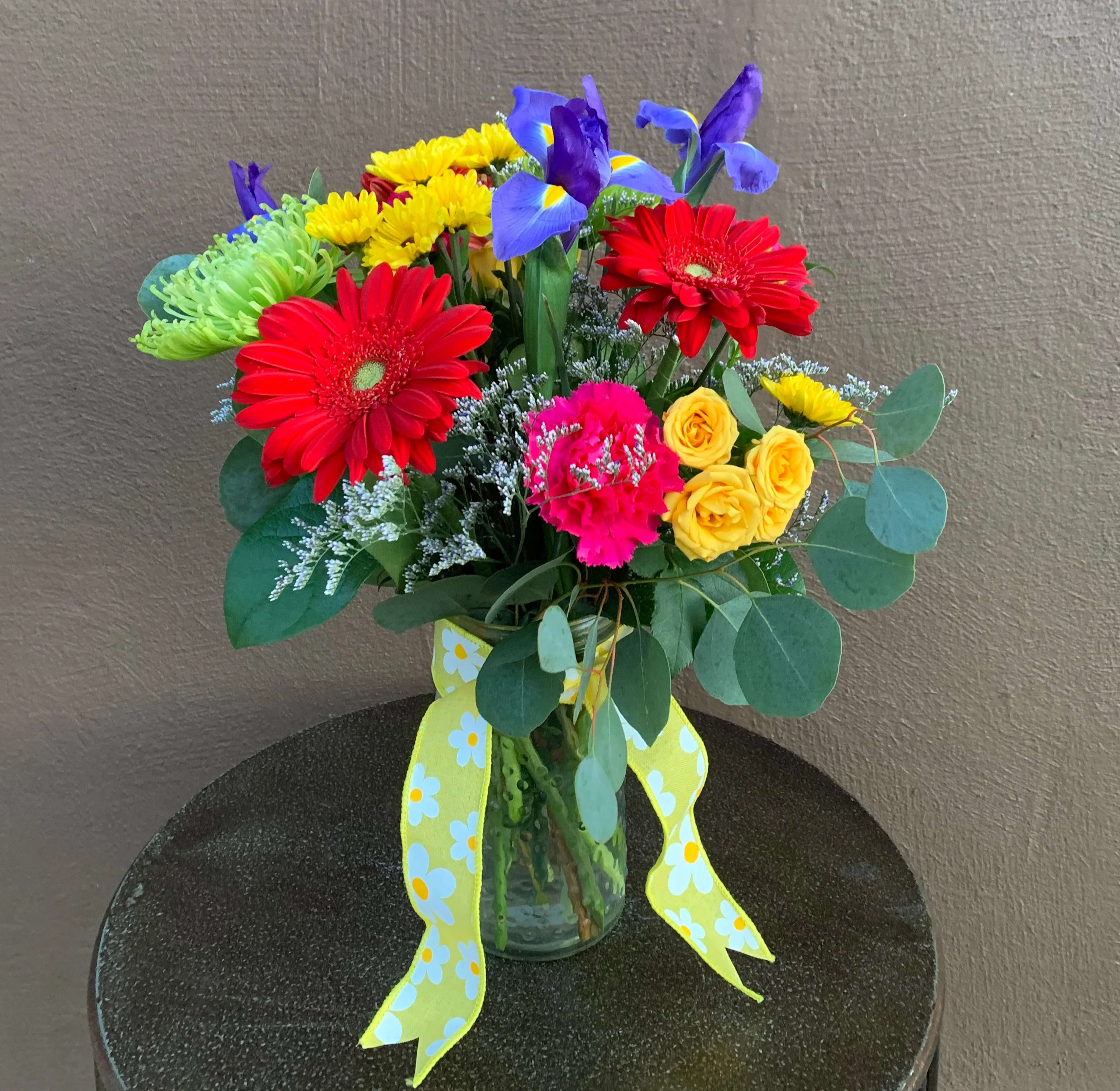 The Garden - Vase of bright gerbera, fugi mums, iris, button mums, spray roses and carnations