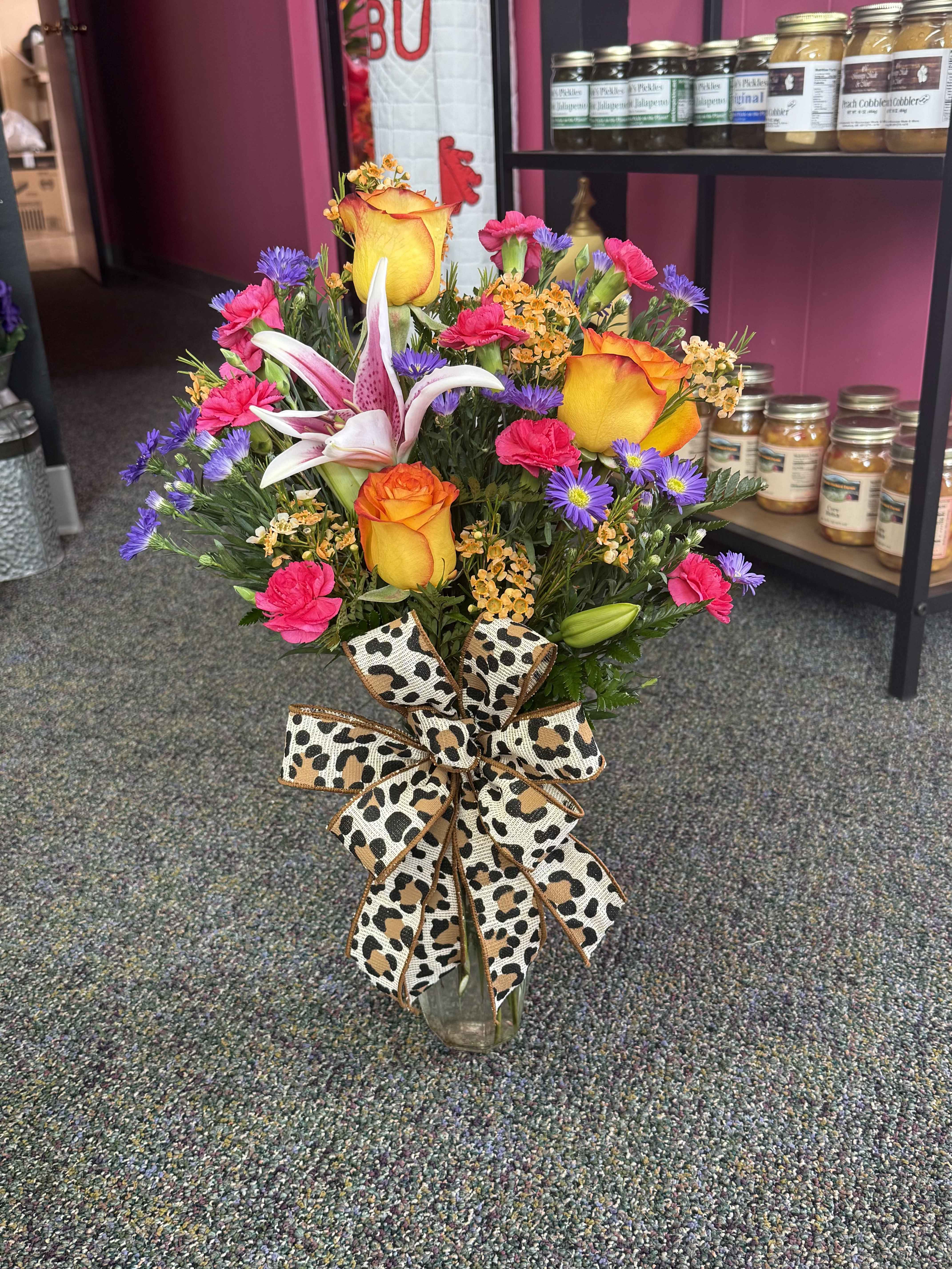 Super Bud Vase - Introducing our Super Bud Vase Mix, a vibrant fusion of various blooms in one enchanting arrangement. Bursting with a kaleidoscope of colors and textures, this eclectic display features a harmonious blend of roses, lilies, daisies, and more, creating a captivating tapestry of floral beauty. Each flower complements the others, harmonizing to form a stunning visual symphony that will brighten any room and bring joy to all who behold it. Perfect for adding a splash of color and charm to your space, the Super Bud Vase Mix is a delightful expression of nature's diversity and elegance.  **Designers Choice** **Call for special colors** (870) 352-0273 