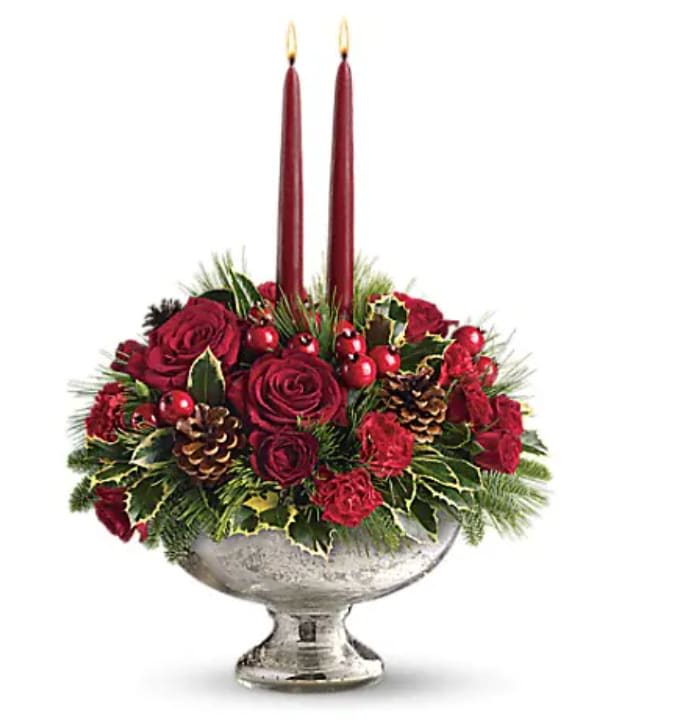 Mercury Glass Bowl Bouquet - Invited to a holiday gathering? Help set the mood and the table by sending this festive holiday centerpiece a day or two before the event. Your hosts will be impressed and incredibly grateful. Plus, they'll be able to use the stunning Mercury Glass Bowl for years to come. Beautiful red roses, spray roses, carnations and berries are arranged with pine and fir branches, pinecones and holly. Two elegant taper candles complete this perfect arrangement.   Orientation : All-Around  All prices in USD ($)  Standard  T112-1A  Deluxe  T112-1B  Premium  T112-1C