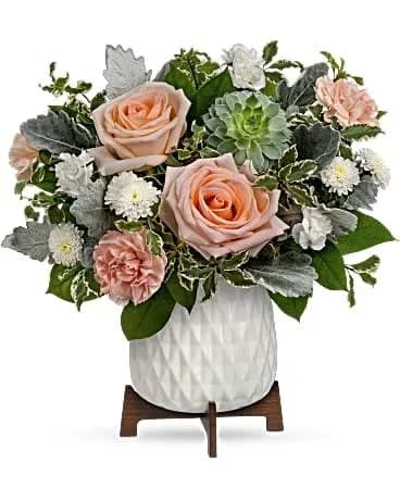 Mod Rose Bouquet - Peachy blooms and sculptural succulents make a chic statement when arranged in this mid-century modern ceramic pot with wood stand. Peach roses, white button spray chrysanthemums, peach carnations and miniature white carnations are arranged with pitta negra, lemon leaf and dusty miller. Delivered in a Mid Mod Geometric Planter. 