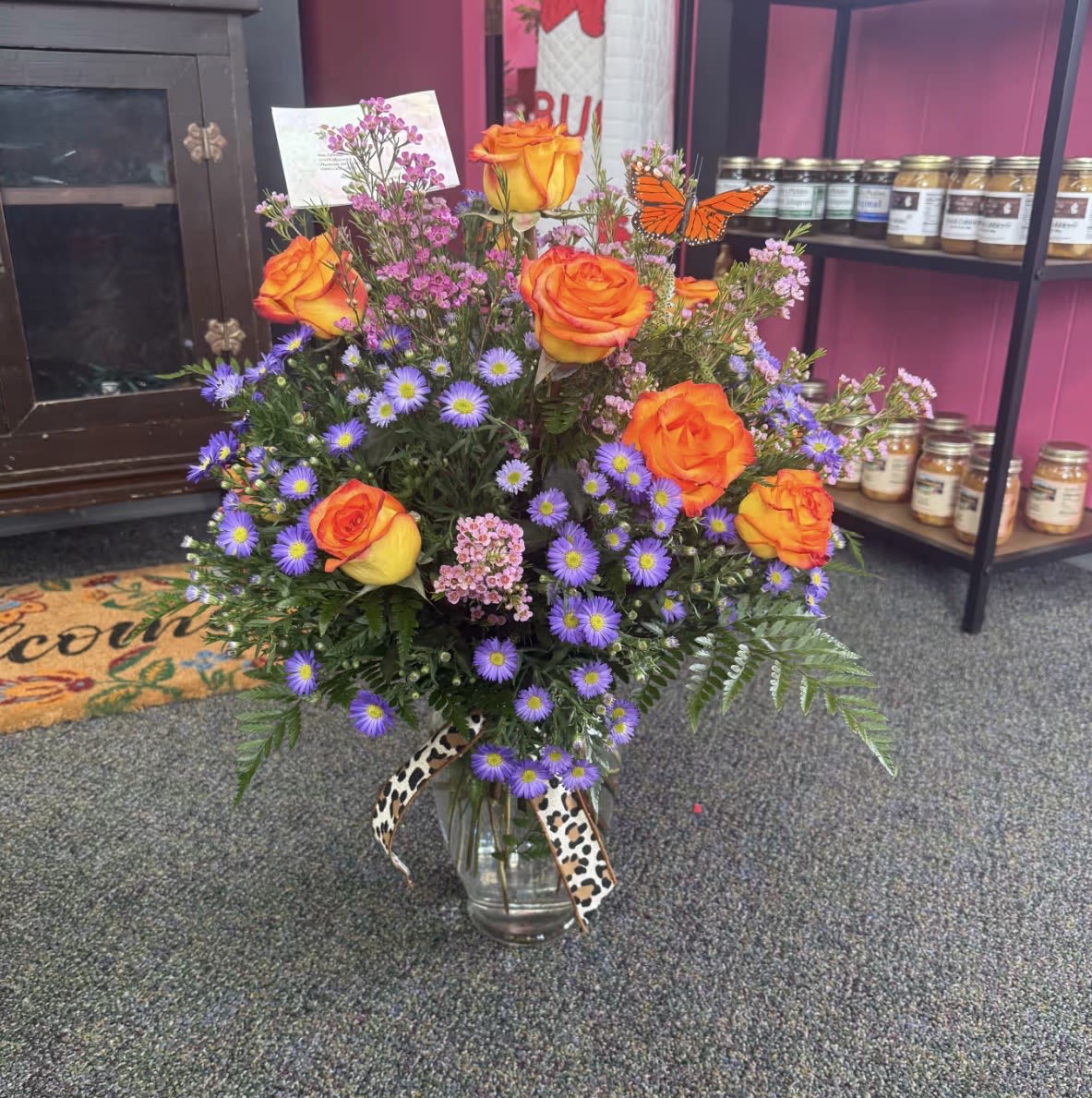 Valentine's Dozen Roses - Twelve beautiful roses arranged with fresh greenery and Valentine accents. A timeless and romantic way to say “I love you” this Valentine’s Day.