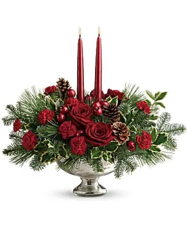 Shining Bright Centerpiece - Deck the halls with this elegant centerpiece of rich red roses and fresh Christmas greens, artistically arranged in a glorious mercury glass bowl with elegant taper candles. This lush centerpiece showcases red roses, red miniature carnations, variegated holly, noble fir, and white pine. Delivered in a Mercury Glass bowl.