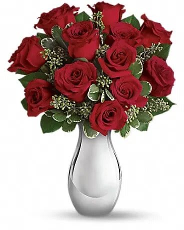 True Romance Bouquet with Red Roses - Turn up the heat on a new romance - or a lifelong love affair - with this classic composition. It features one dozen of our finest red roses arranged in our stunning Silver Reflections vase. This romantic bouquet includes twelve red roses accented with seeded eucalyptus and variegated pittosporum, all delivered in our exclusive Silver Reflections vase, a metalized ceramic vase with a light pink tone. 