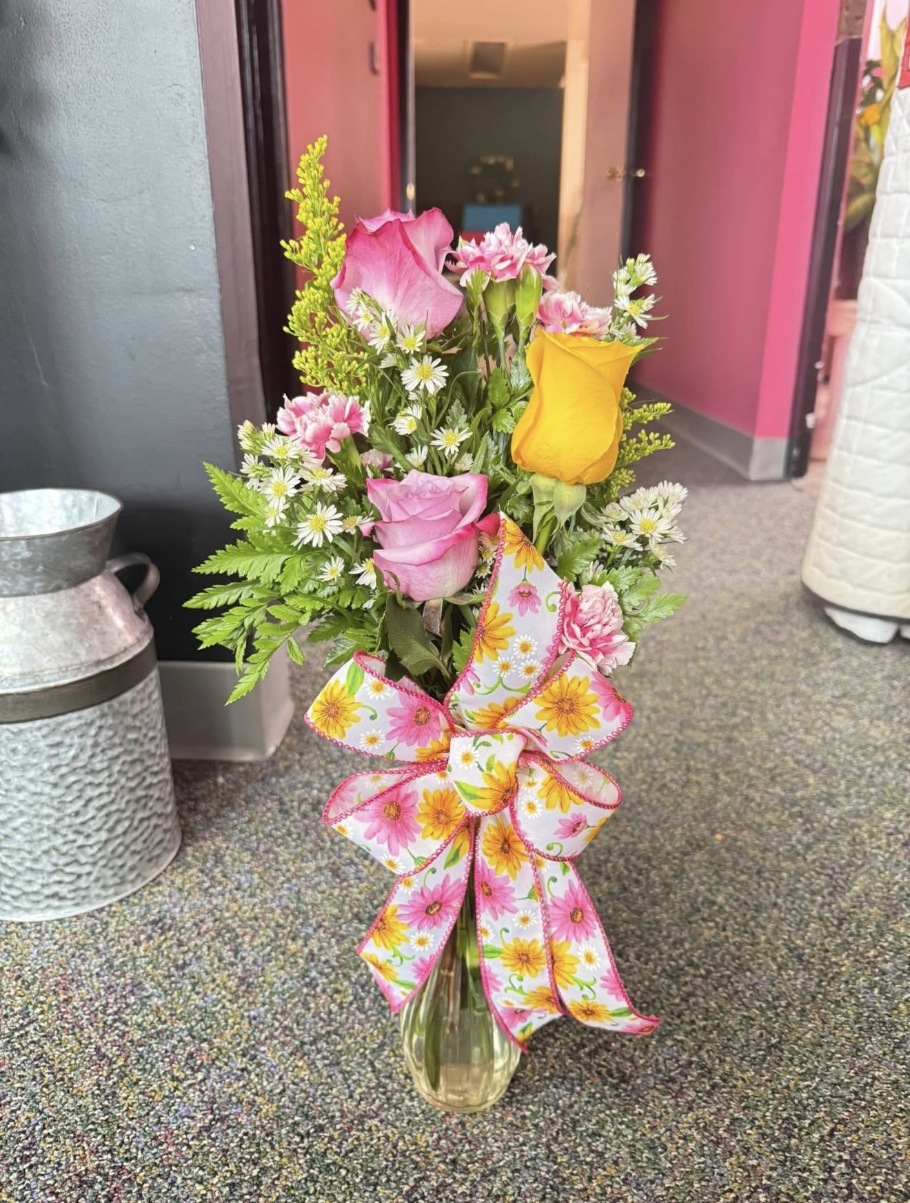 Valentine's Triple Bud Vase - Three fresh Valentine blooms arranged together in a clear glass bud vase. A sweet and cheerful design that adds the perfect touch of love to any space.