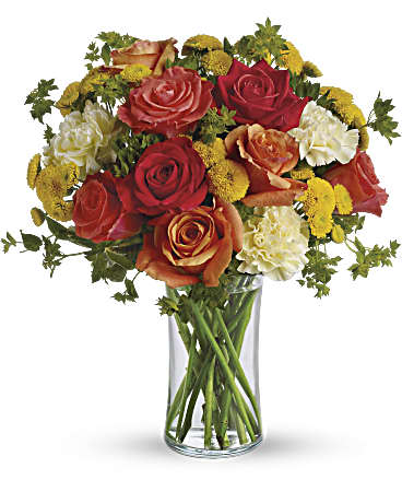 Citrus Kissed - Like freshly squeezed lemonade on a hot sunny day, this bright and cheerful bouquet is a summer sensation. Dark orange, coral and orange roses, light yellow carnations, yellow button spray chrysanthemums and greens fill a slender gathering vase. It's a kiss of summer!