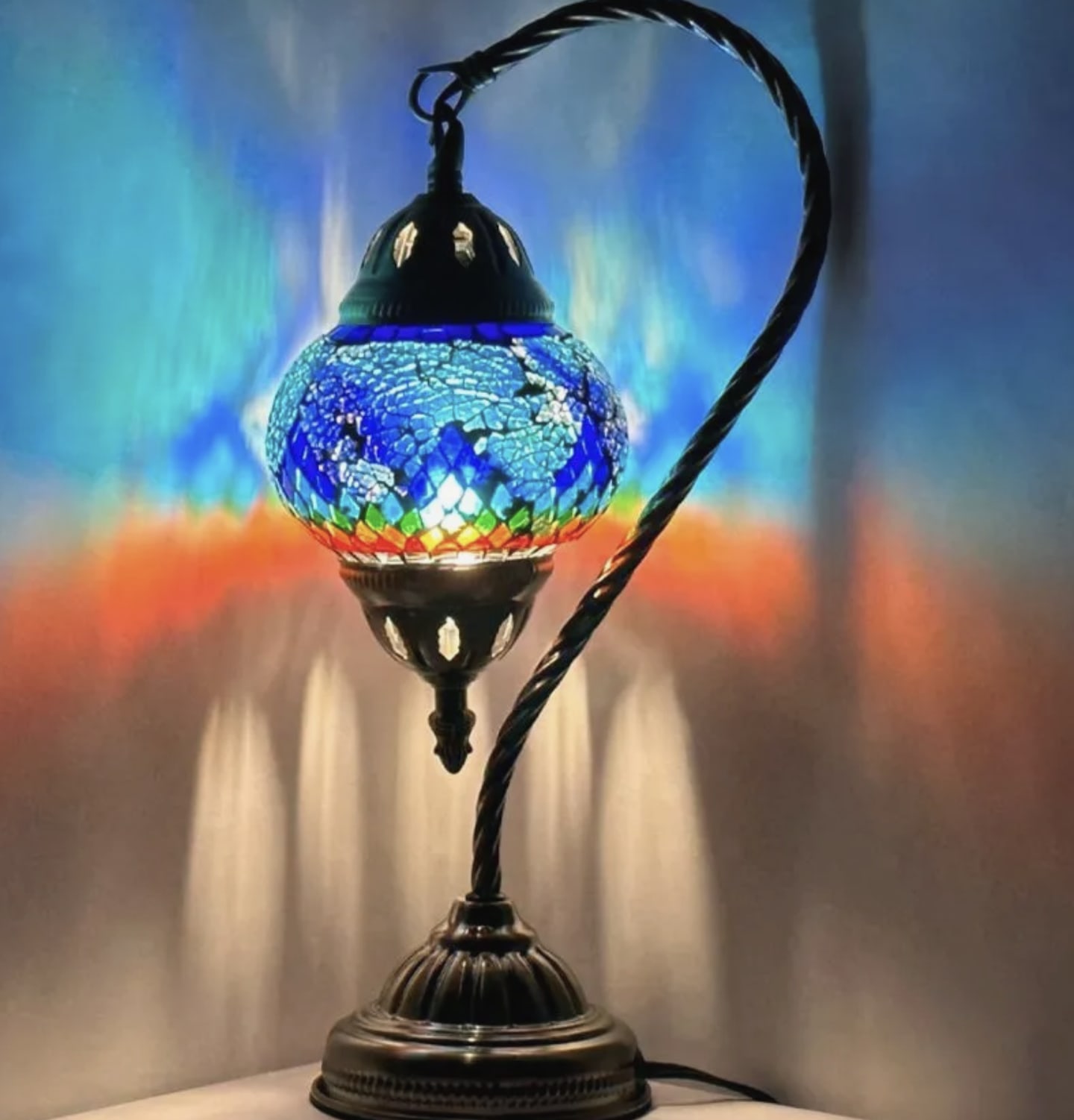 Swan Neck Mosaic Lamp (Small) - These beautifully crafted lamps are made with colourful glass pieces in intricate designs that create a warm and inviting atmosphere in any room. Good for sympathy gifts or just a gift to brighten someone's room! Please note: Photos are for reference only. Actual designs and quotes may vary. If you are looking for a specific style we kindly ask that you give us a call to discuss availability and options.