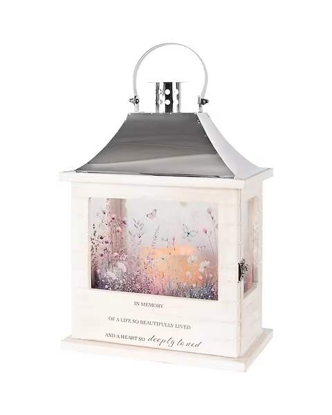 Wooden Slat Lantern - Our Wooden Slat lanterns are made with quality wood with a stainless steel finish top. They come inscribed with sentimental quotes amid beautiful artwork on all four sides and a charming flameless LED candle. Suitable for hanging or use as a freestanding item. Please note: Photos are for reference only. Actual designs and quotes may vary. If you are looking for a specific style or inscription, we kindly ask that you give us a call to discuss availability and options.