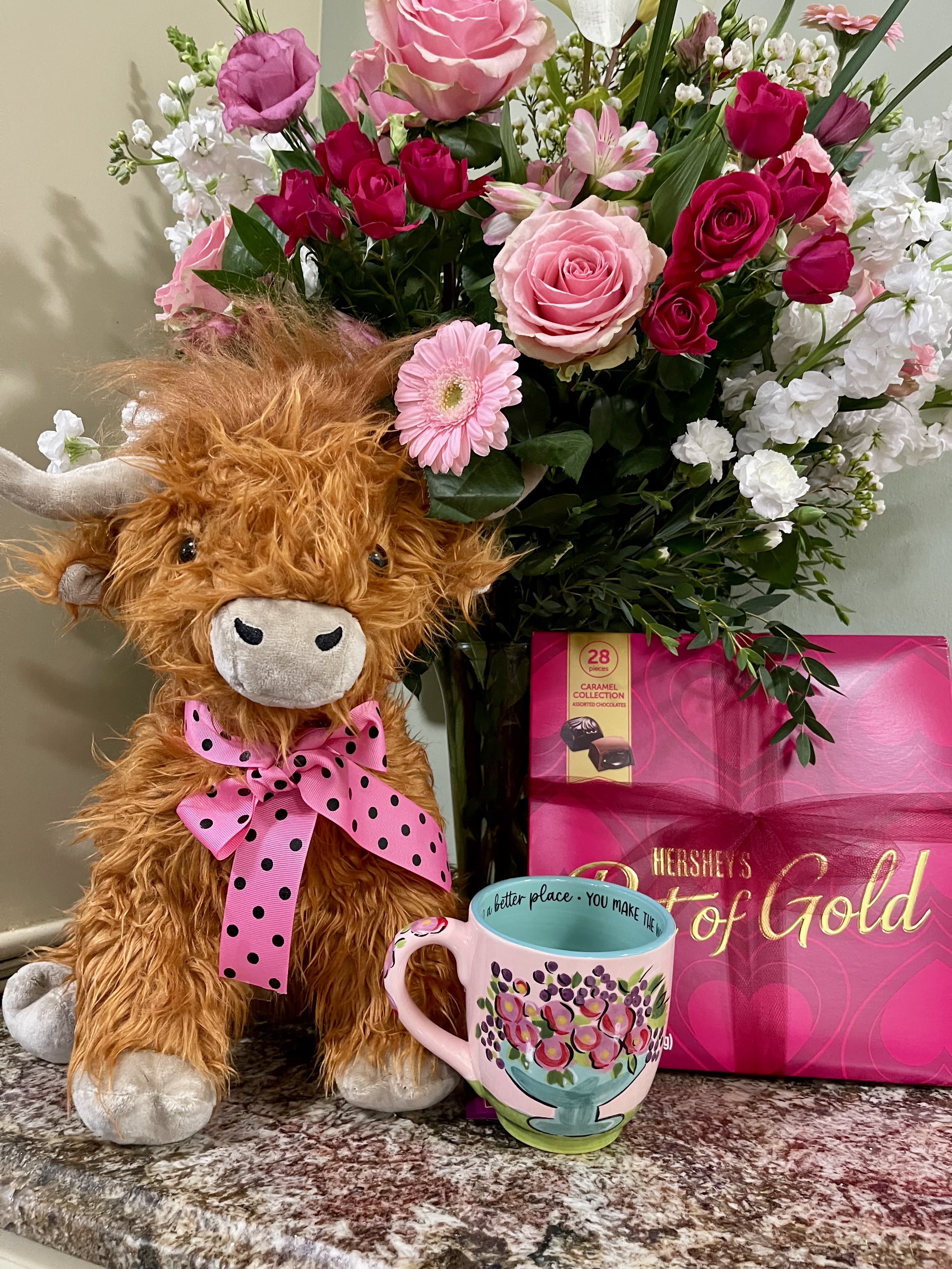 The Legacy Florals Highland Valentine Bundle - The Legacy Floral Highland Valentine Bundle is the perfect gift for the girl who loves Highlands and also loves beautiful flowers and chocolates.  This bundle includes a beautiful cup with "You Make the World a Better Place" inscribed on the inside.  A gorgeous vase of Valentine's roses and flowers unless you request specific colors.  Can be customized.