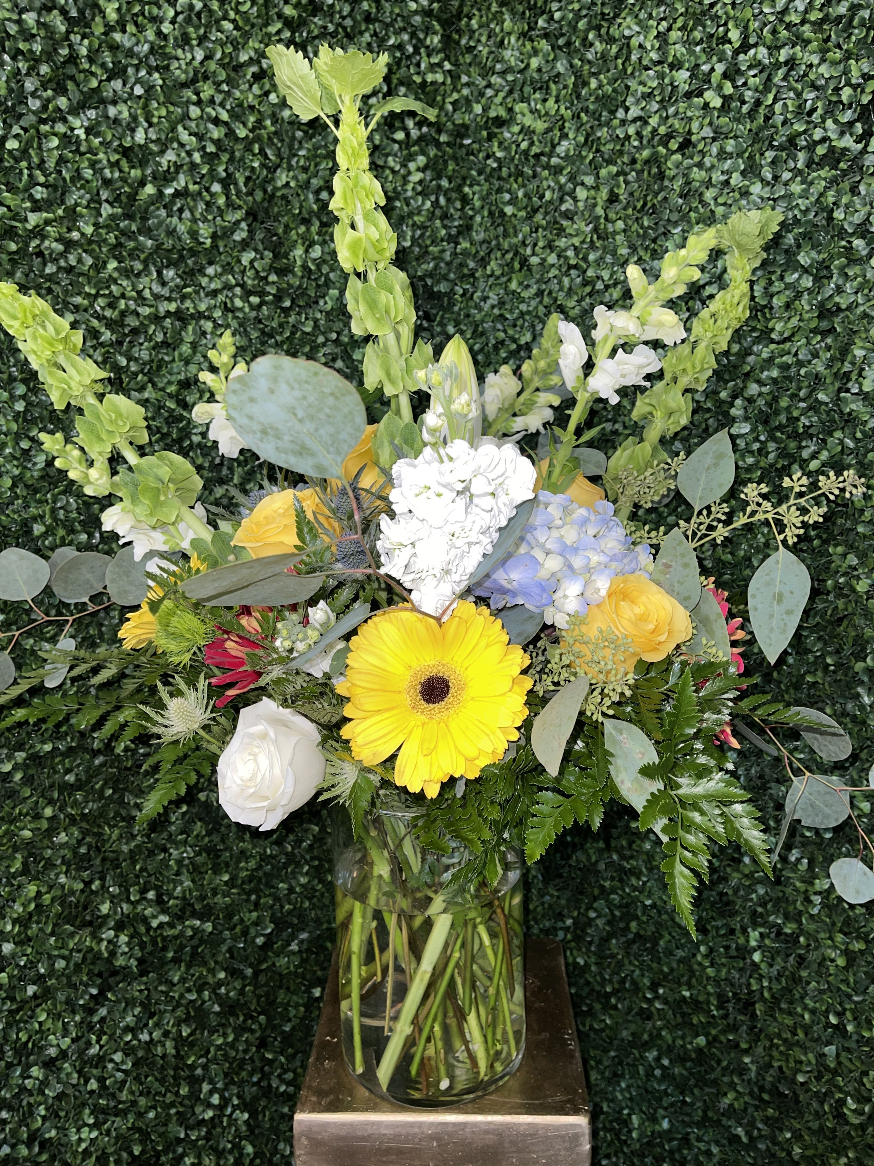 Premium Designer's Choice Arrangement - Not sure what to order? Indulge in our most luxurious floral experience. This premium arrangement is crafted completely in-house by our designer, using the freshest seasonal blooms in rich textures and bold colors. No two arrangements are ever the same — each one is a unique work of art created to surprise, impress, and elevate any space. For any occasion.    *If this arrangement is for a funeral or memorial service, we will thoughtfully our designer will modify the color palette to ensure it is appropriate for the service.