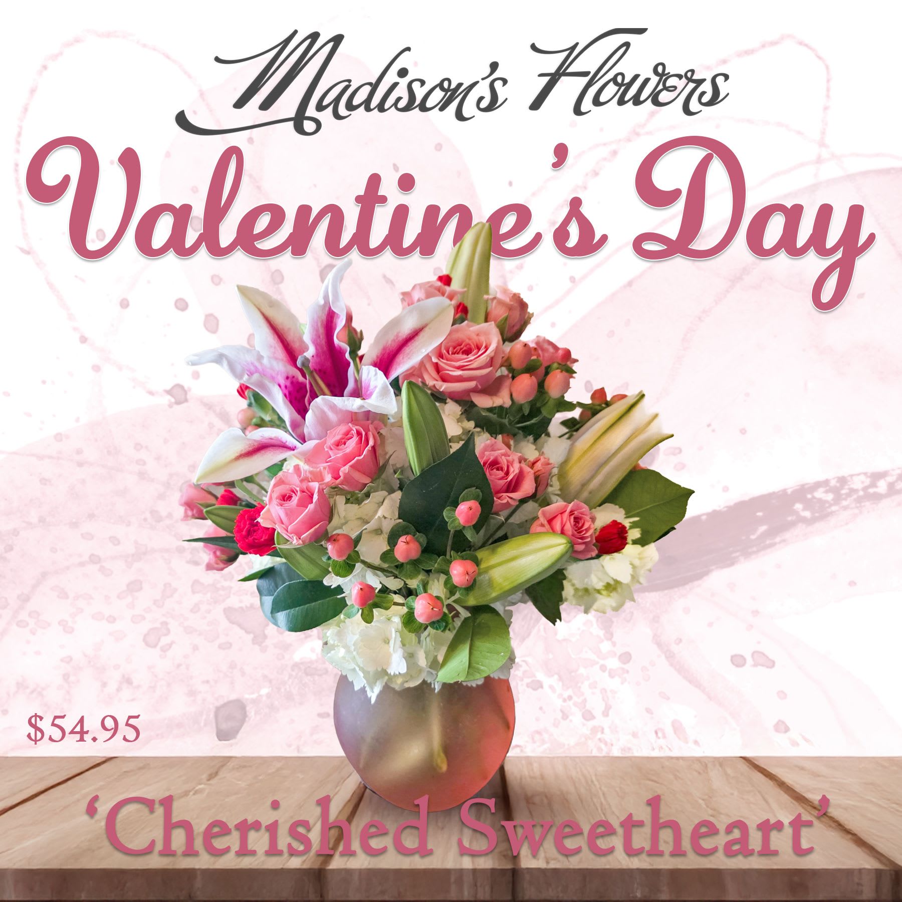 'Cherished Sweetheart' by Madison's Flowers - A demure Valentine’s Day table-top arrangement for the ‘Cherished Sweetheart’ in your life. Packed with blooms in soft pink, magenta, and rose, with pops of red “sweethearts”.  We will select the season’s best to complete the design. If there is a special flower yo are seeking, please let us at Madison’s Flowers know and we will do our best to accommodate your request. Happy Valentine’s Day.