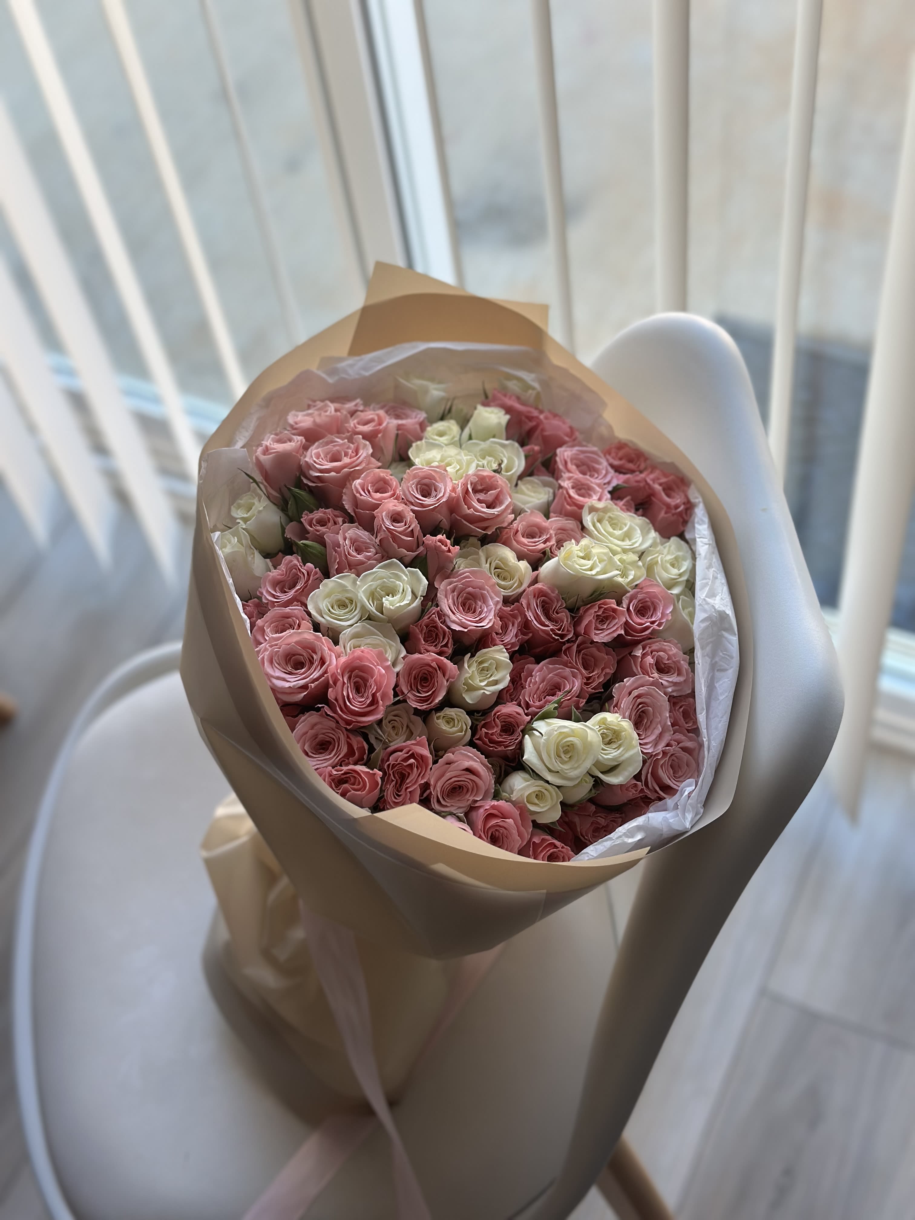 Harmonie Rosée - A soft and elegant bouquet of blush pink and ivory spray roses, delicately arranged in a harmonious composition. “Harmonie Rosée” captures purity, balance, and quiet romance — a graceful gift for birthdays, baby showers, anniversaries, or moments when you want to express warmth and sincere affection. Light, refined, and endlessly charming.