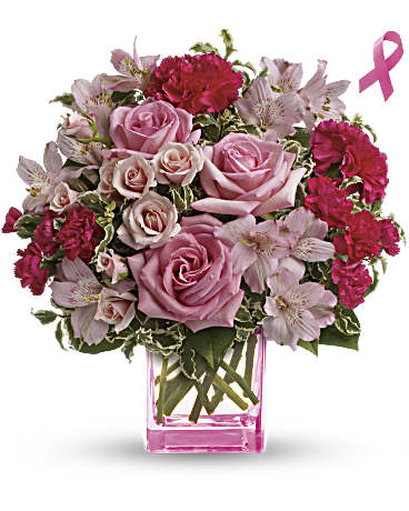Teleflora's Pink Grace Bouquet - Celebrate a fabulous woman in your life with a beautiful mixed bouquet featuring pink roses and arranged in a perky pink cube. She'll be thrilled with this charmingly feminine gift - and touched by your thoughtfulness because it is also a gift for others! Send this featured bouquet and Teleflora will donate 15% of the purchase price to support the vital work of the Breast Cancer Research Foundation®. The lovely bouquet includes pink roses, pink spray roses, hot pink carnations and soft pink alstroemeria accented with assorted greenery. Orientation: All-Around