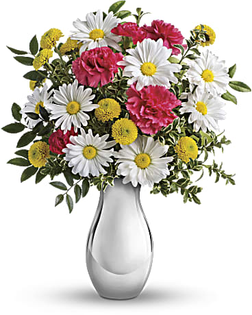 Just Tickled Bouquet by Teleflora - Imagine how tickled she'll be when this sweet bouquet comes her way! Arranged in our shimmering Silver Reflections vase - a gift she'll adore for years to come - this cheerful mix of hot pink carnations and crisp white daisies is a bright reminder of how much you care. Beautiful hot pink carnations and miniature carnations, white daisy chrysanthemums and yellow button chrysanthemums are arranged with fresh huckleberry and oregonia. Delivered in a Teleflora Silver Reflections vase. Orientation: All-Around