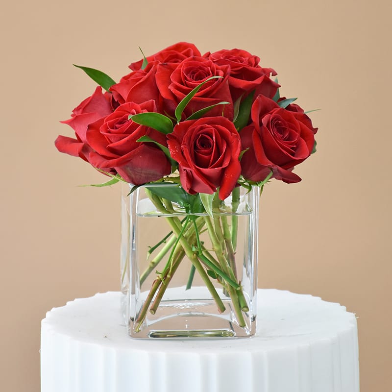 Cherished Treasure - W613 - Show the apple of your eye you love and adore them with Fillmore Florists Cherished Treasure flower arrangement. Cherished Treasure is made with 12 premium red Roses in a clear cube glass vase. Order fresh Roses from Fillmore Florist San Francisco today!   