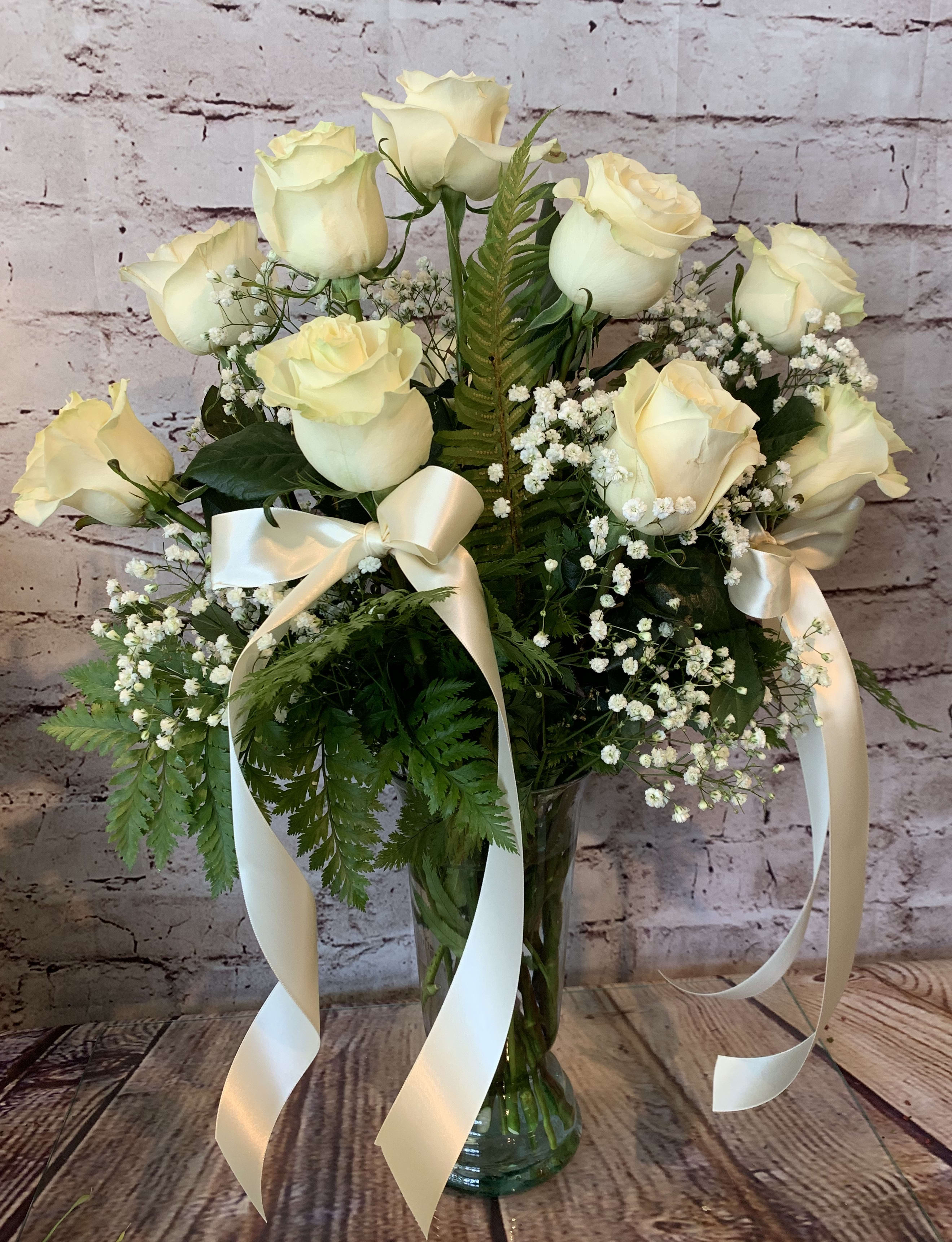  “ESTELLE” - Huge 12 long-stemmed, fragrant cream garden roses. Hand designed in a clear vase and trimmed with satin ribbons.