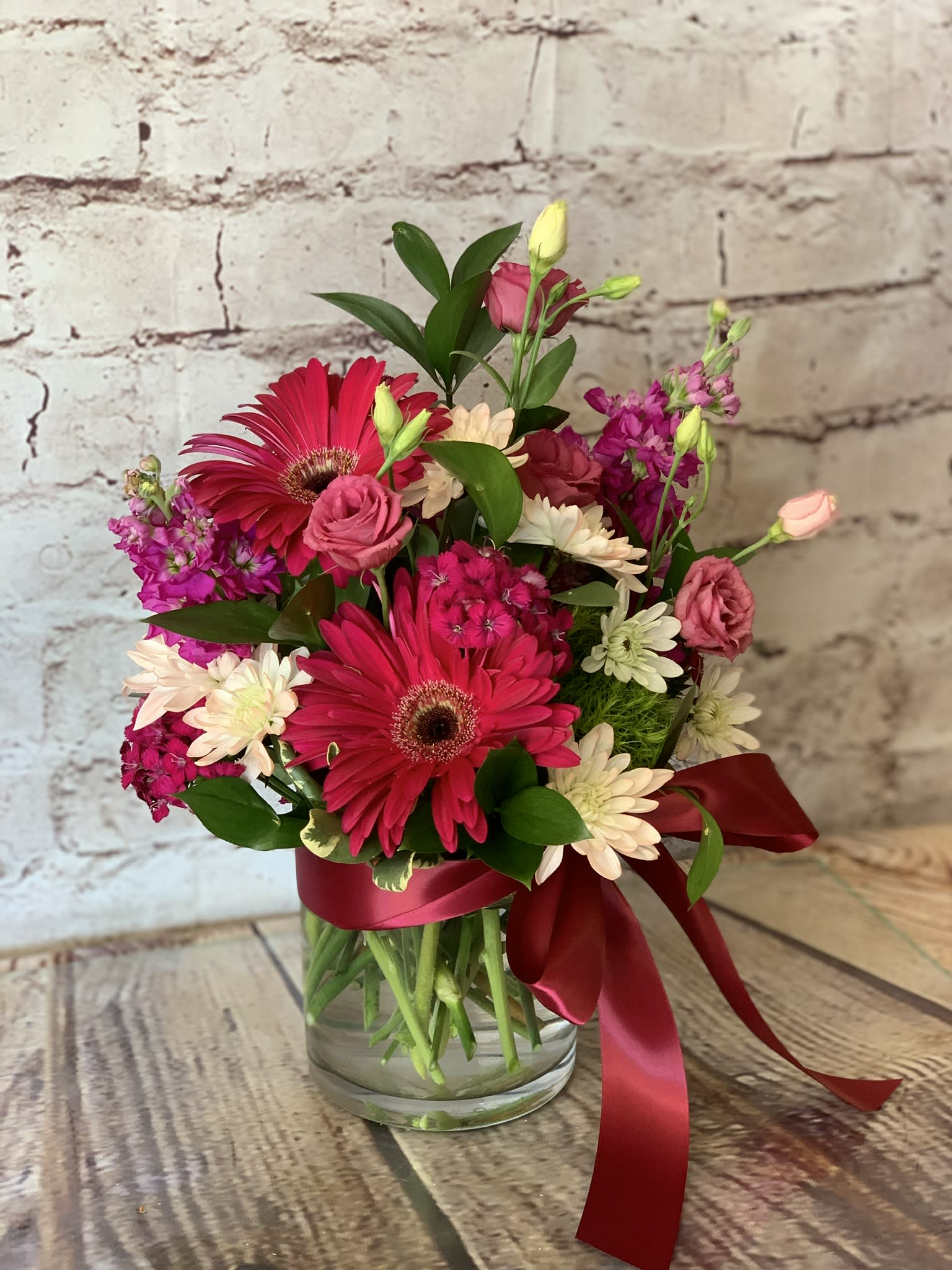 "HOPE" - This "Hope" arrangement has a sweet fragrance that will give your recipient an amazing sensory experience! Brilliant shades of fuchsia....Lush and lovely!