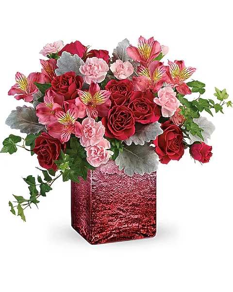 OOH LA OMBRE BOUQUET - Express to impress! Make a big, bold statement with this modern Valentine's Day bouquet, beautifully arranged in this shimmering ombre cube of distressed mercury glass. Hot pink spray roses, pink alstroemeria, and light pink miniature carnations are arranged with green ivy and dusty miller. Delivered in an Ooh La Ombre cube.  Orientation : All-Around All prices in USD ($) Due to an increase in the cost of flowers and supply chain shortage, some product prices may be impacted during the Valentine's day delivery period.