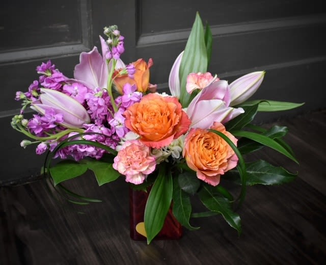 Pillow Talk Premium - Available for Local St. Cloud, MN Delivery Only - Pillow Talk whispers sweet nothings with every bloom. Peach roses, lovely pink lilies, and stock come together to create a romantic, serene display that evokes the warmth and intimacy of quiet moments shared with someone special. This bouquet is the perfect expression of love, tenderness, and affection—just like the cozy conversations that linger long after the day is done.