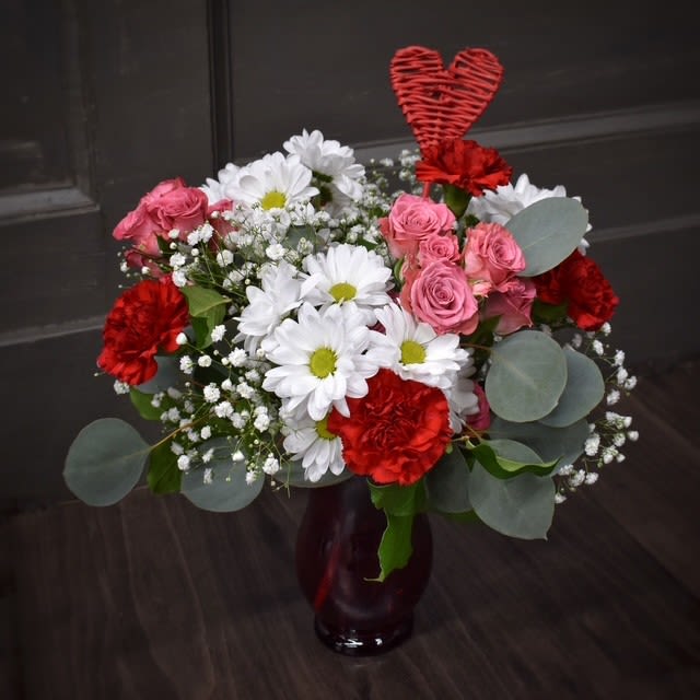 Sweetheart Bouquet - Available for Local St. Cloud, MN Delivery Only - The Sweetheart Bouquet is a delightful mix of fresh, vibrant daisies and romantic red &amp; pink accents, making it the perfect way to share the love this Valentine’s Day. 