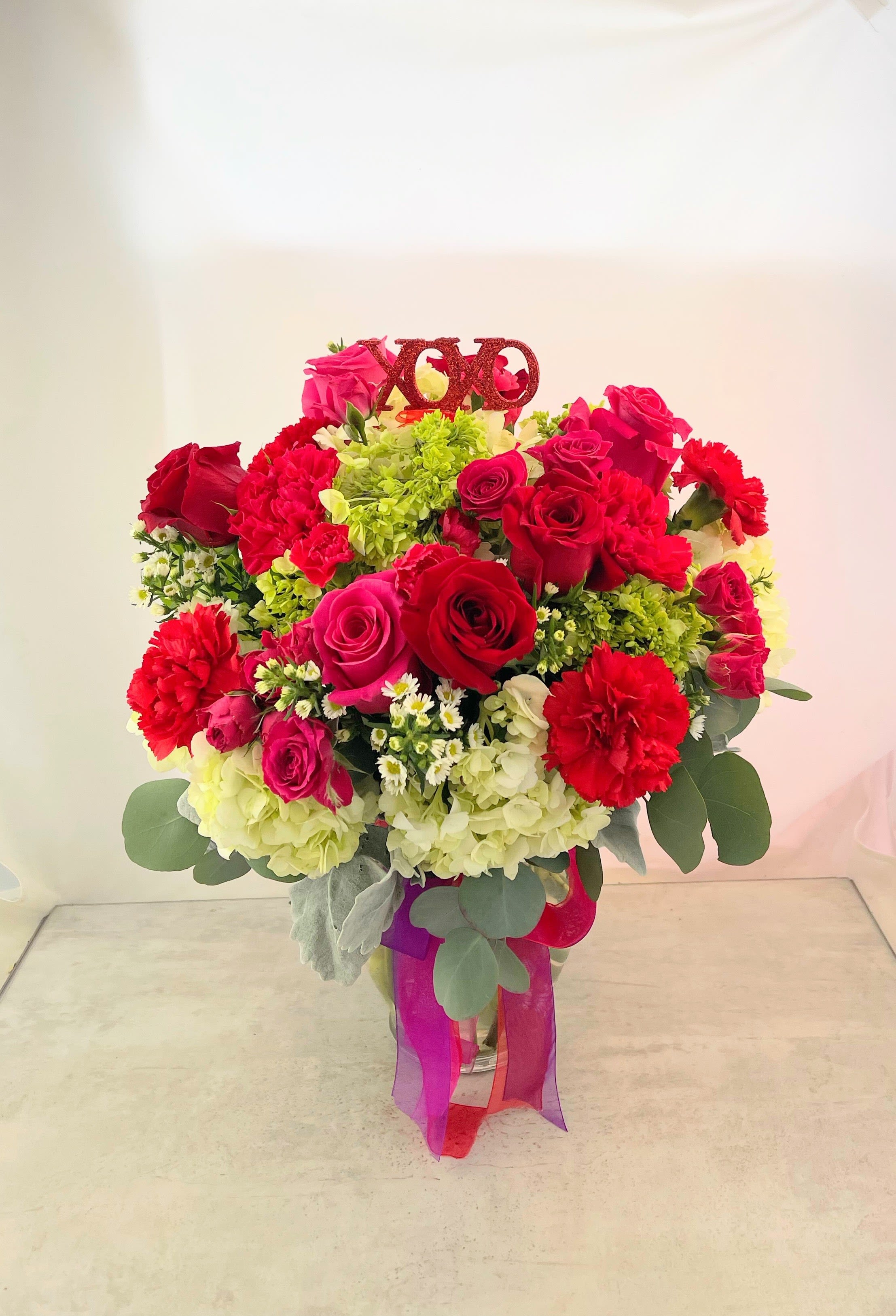 Enchanted Romace - When When Cupid call for something special this Valentine's Day, our Enchanted Romance bouquet will deliver! Filled with red and pink roses, hydrangea eucalyptus and more your Valentine will be filled with loving thoughts of you! 