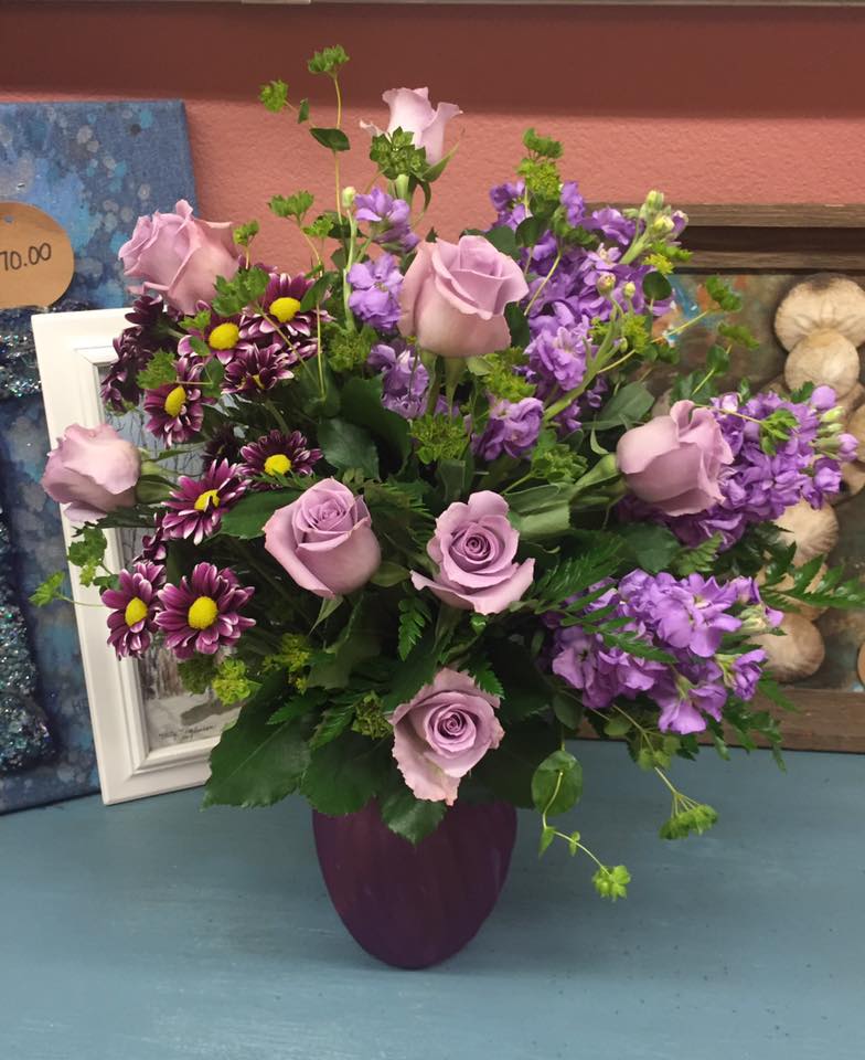 Together At Twilight  - Capture the magic of togetherness with this bountiful bouquet of enchanting lavender roses (may substitute lavender roses for white). Artfully arranged in a glass vase its twilight hues are sure to brighten anyone's day! 