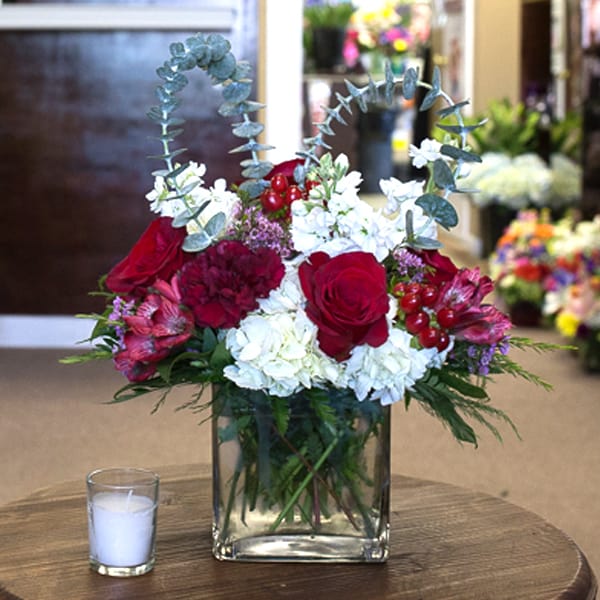 Cube of Love - Red roses, hydrangea, and a eucalyptus heart come together to create the sweetest arrangement, to show someone how you feel.