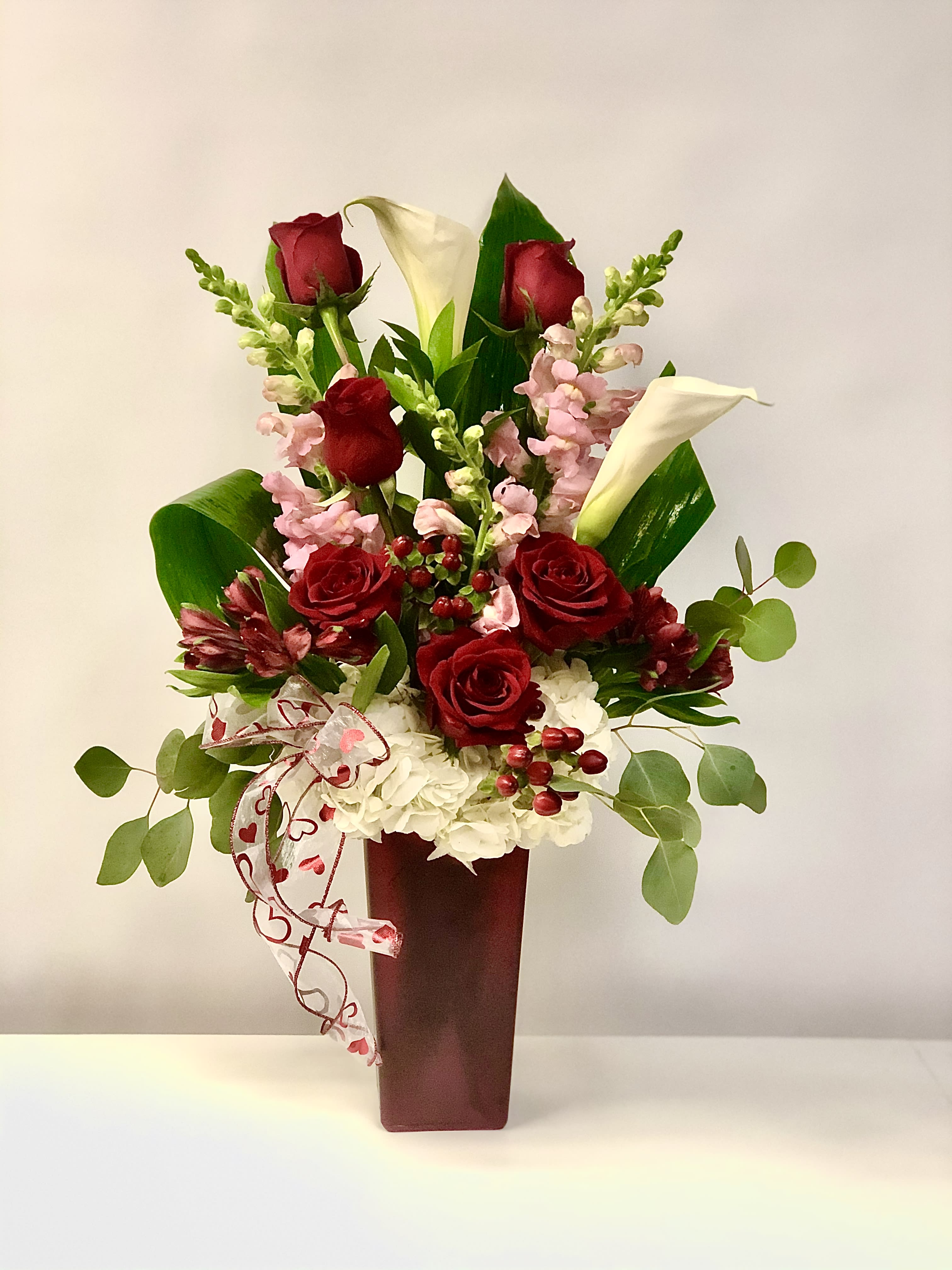 Tall and lovely - Mix flower in a tall vase include Roses, calla lilies,Snapdragon, Hydrangea. 