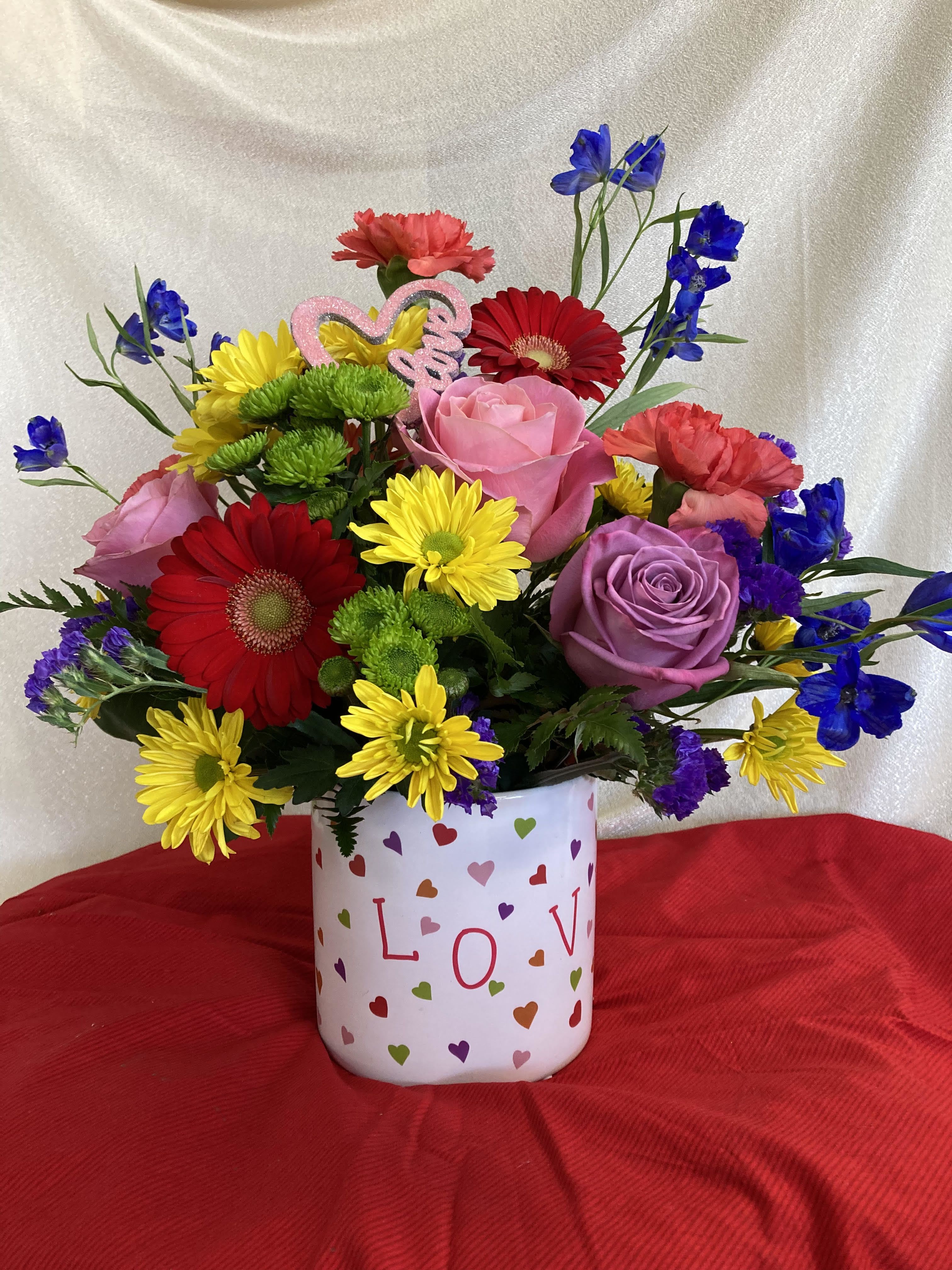 You color my world! - This colorful valentine arrangement will put a smile and light up your valentine's face for sure.