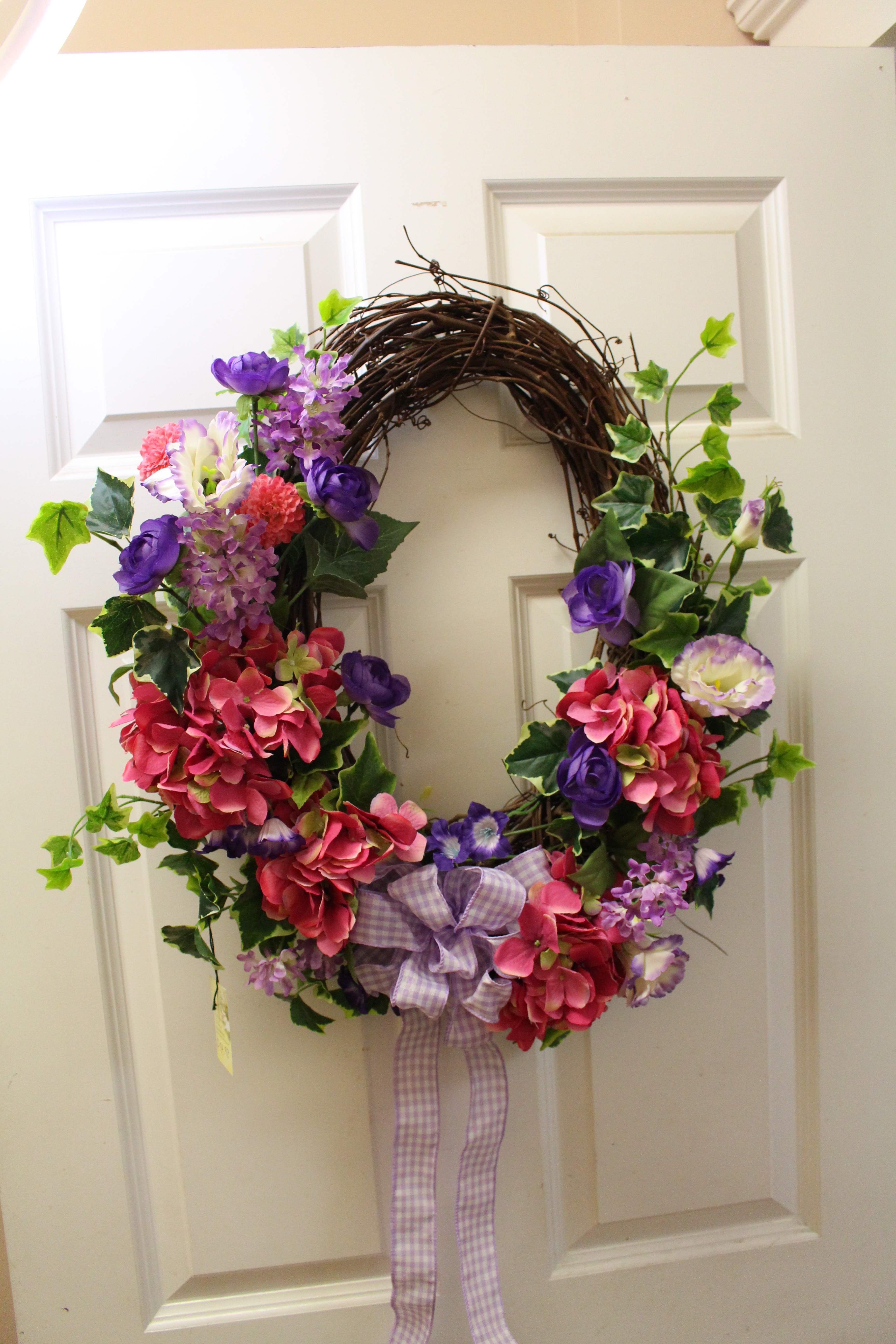 Spring blossoms  - a grapevine wreath filled with pink hydrangea and purple lisianthus 