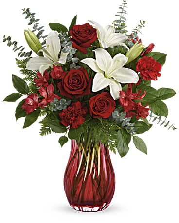 Love Conquers All  - Give Valentine's Day a dramatic twist with this romantic, swirling glass vase. Its ruby red ombre hue is the perfect complement for ravishing red roses and snow white lilies.
