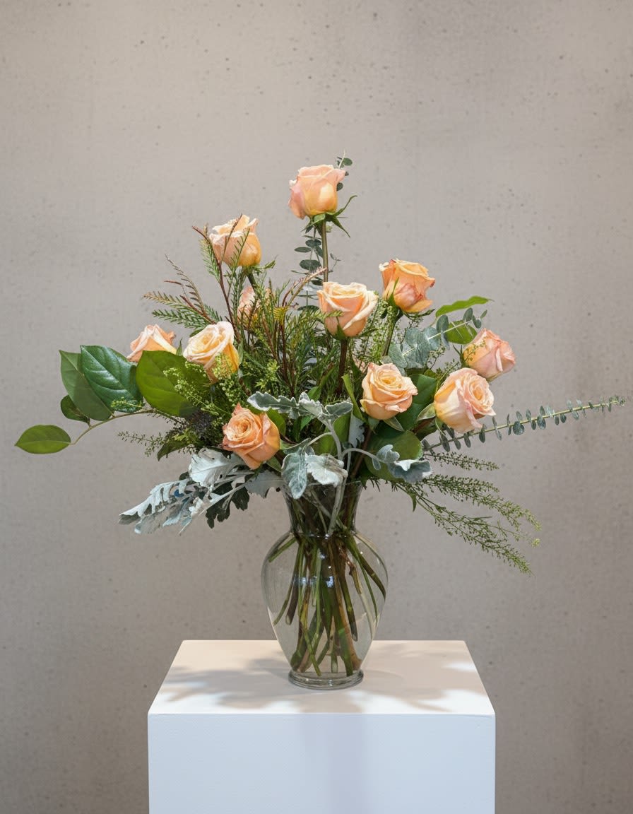 Shimmering LOVE Dozen Rose Arrangement - When love deserves a little extra sparkle. This Valentine’s Day favorite features one dozen premium roses dusted with a soft, romantic shimmer, nestled among fresh eucalyptus for a lush, airy finish. Elegant, glowing, and undeniably swoon-worthy, this arrangement is designed to make hearts flutter the moment it arrives.  Perfect for Valentine’s Day, anniversaries, or grand romantic gestures, each bouquet is handcrafted in-house by Birch &amp; Blossom with intention, artistry, and just the right amount of magic.  Because when it’s love—you don’t do ordinary. 