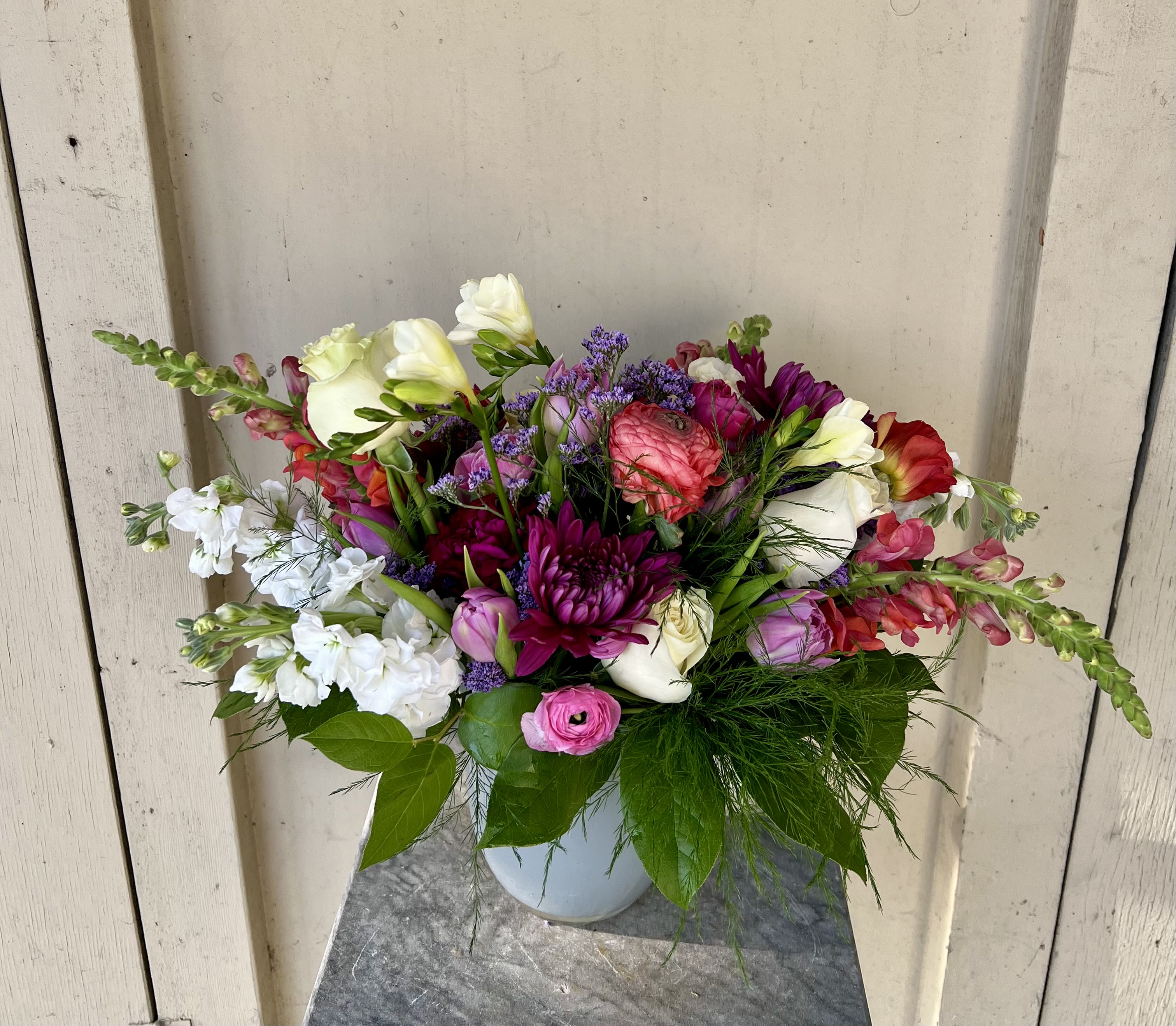 Sweetheart - Sweetheart is a romantic arrangement with a modern, artistic twist. Ranunculus, stock, and flowing tulips mingle beautifully with lush cream and white roses, creating a timeless and elegant gift for the one you love.