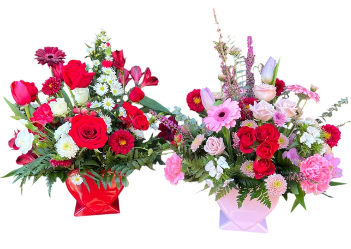 Hearts and Flowers  - A Customer Favorite for Valentine's Day - Heart shaped reusable vase in filled with a colorful flower mix make this a classic favorite for sweethearts everywhere. A year-round favorite. Filled with reds, pinks, and purples...include your color choice when ordering.