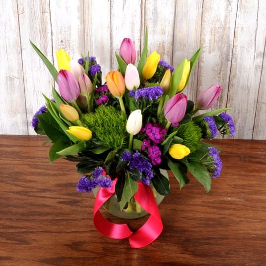 Tulips to Luv - This cute vase is filled with seasonal tulips, dianthus and statice! Perfect for any occasion. 